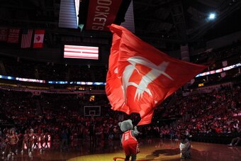 HOUSTON, TX - APRIL 6:  Clutch Mascot of the Houston Rockets gets the crowd excited before the game against the Denver Nuggets on April 6, 2014 at the Toyota Center in Houston, Texas. NOTE TO USER: User expressly acknowledges and agrees that, by downloadi