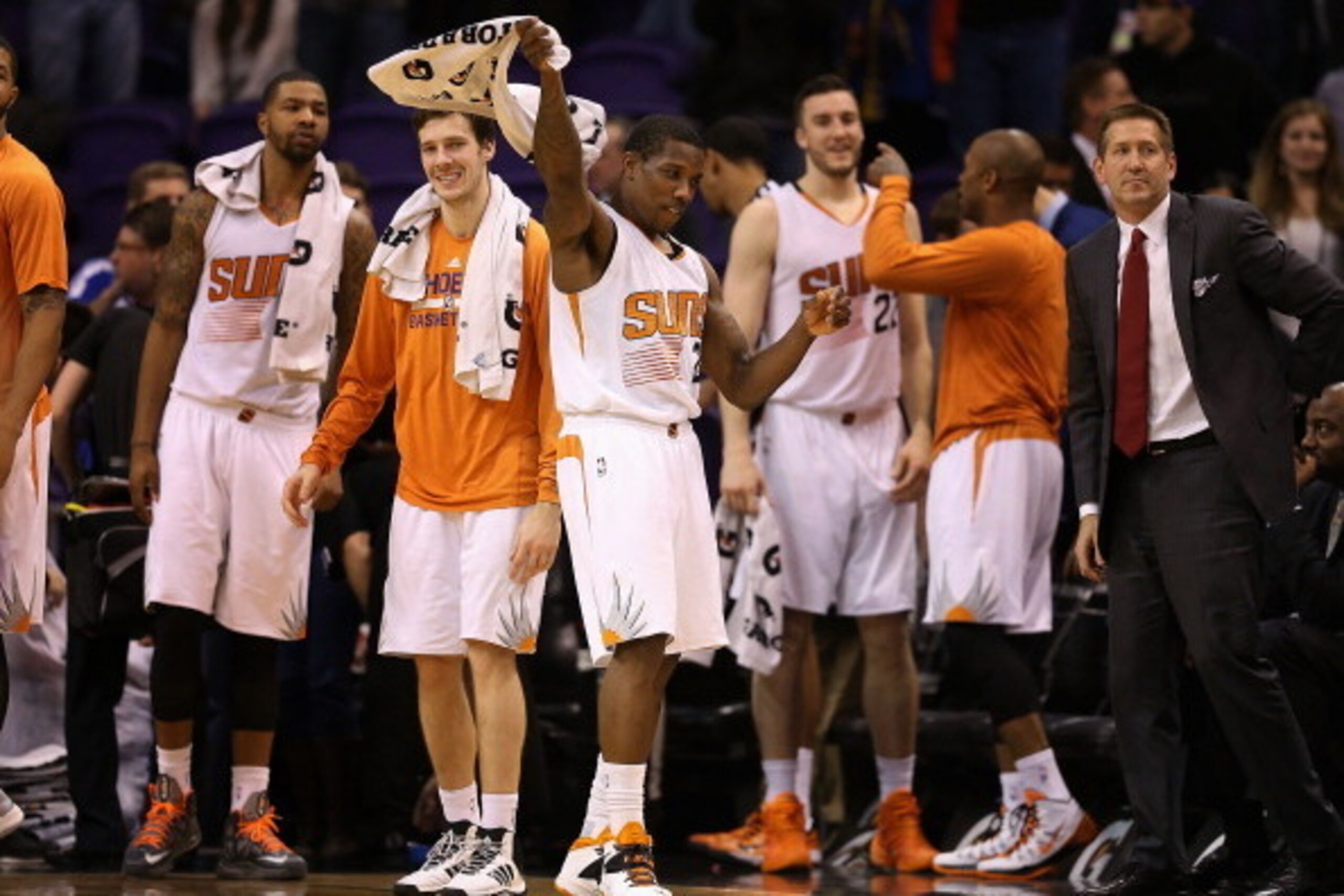 PHOENIX, AZ - DECEMBER 23:  Eric Bledsoe #2 of the Phoenix Suns celebrates on the bench with (back L-R) Marcus Morris #15, Goran Dragic #1, Miles Plumlee #22, P.J. Tucker #17 and head coach Jeff Hornacek during the final moments of the NBA game against th