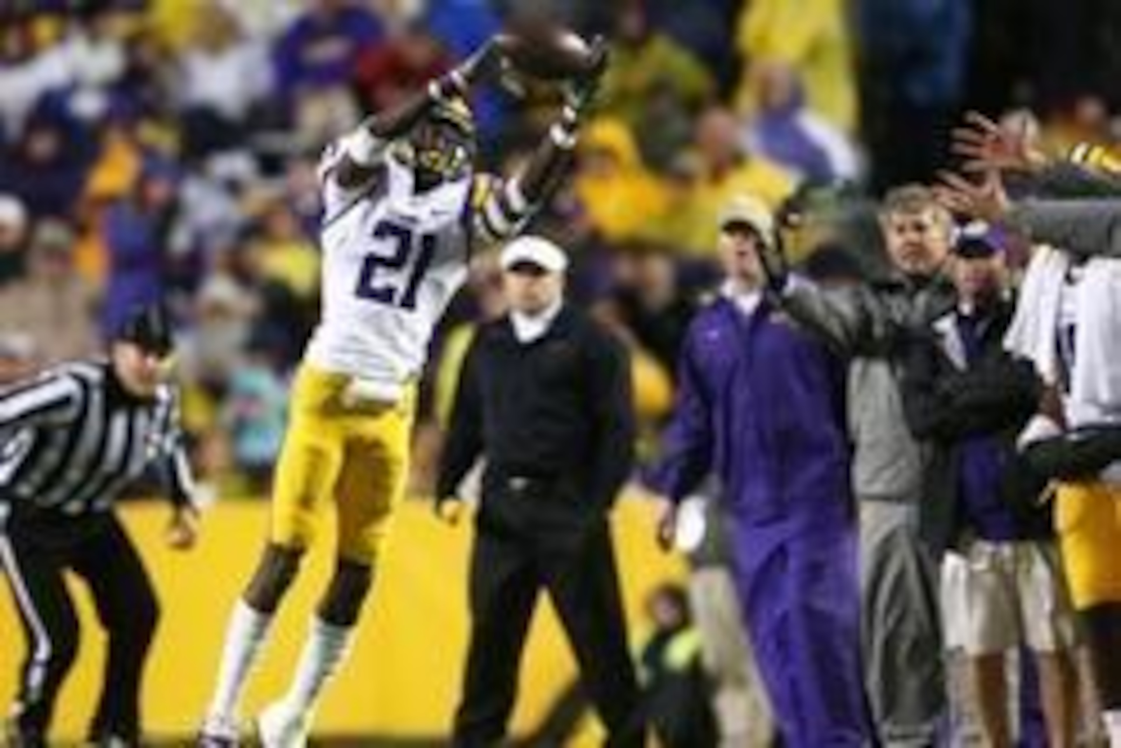 Nov 23, 2013; Baton Rouge, LA, USA; LSU Tigers defensive back Rashard Robinson (21) catches the ball for an interception against the Texas A&M Aggies in the second half at Tiger Stadium. LSU defeated Texas A&M 34-10. Mandatory Credit: Crystal LoGiudice-US