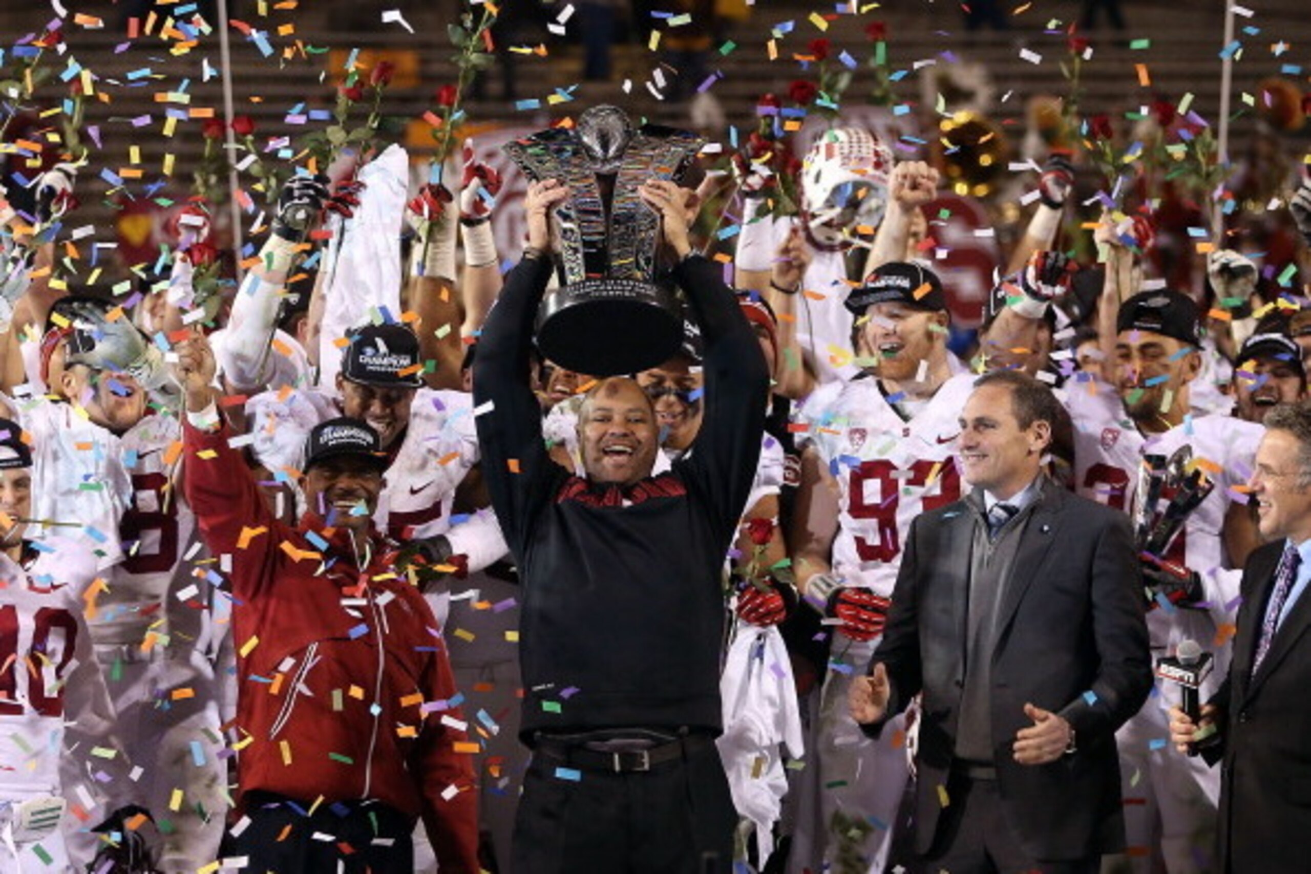 TEMPE, AZ - DECEMBER 07:  Head coach David Shaw of the Stanford Cardinal celebrates with the Pac 12 Championship trophy after defeating the Arizona State Sun Devils 38-14 at Sun Devil Stadium on December 7, 2013 in Tempe, Arizona.  (Photo by Christian Pet