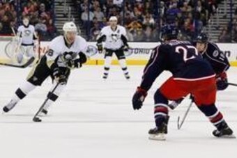 Dec 29, 2013; Columbus, OH, USA; Pittsburgh Penguins center Joe Vitale (46) skates with the puck as Columbus Blue Jackets defenseman Ryan Murray (27) defends during the third period at Nationwide Arena. Pittsburgh won 5-3. Mandatory Credit: Russell LaBoun