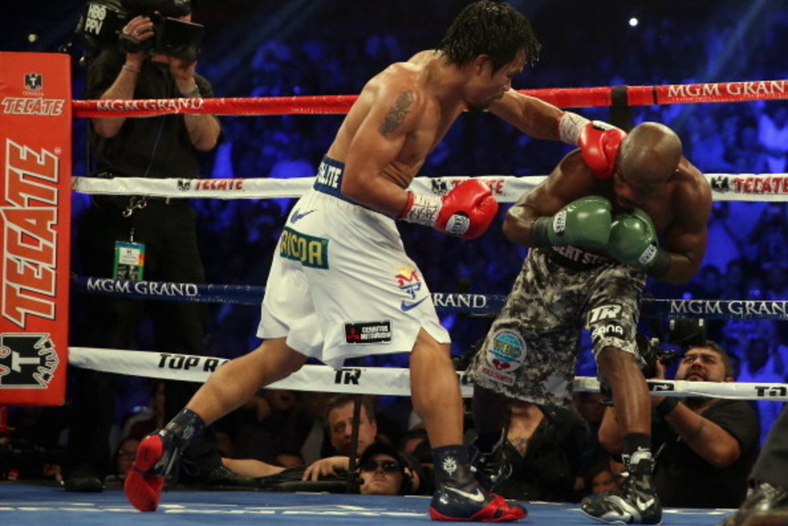 LAS VEGAS, NV - APRIL 12:  Manny Pacquiao throws a left hand at Timothy Bradley at the MGM Grand Garden Arena on April 12, 2014 in Las Vegas, Nevada.  (Photo by Jeff Gross/Getty Images)