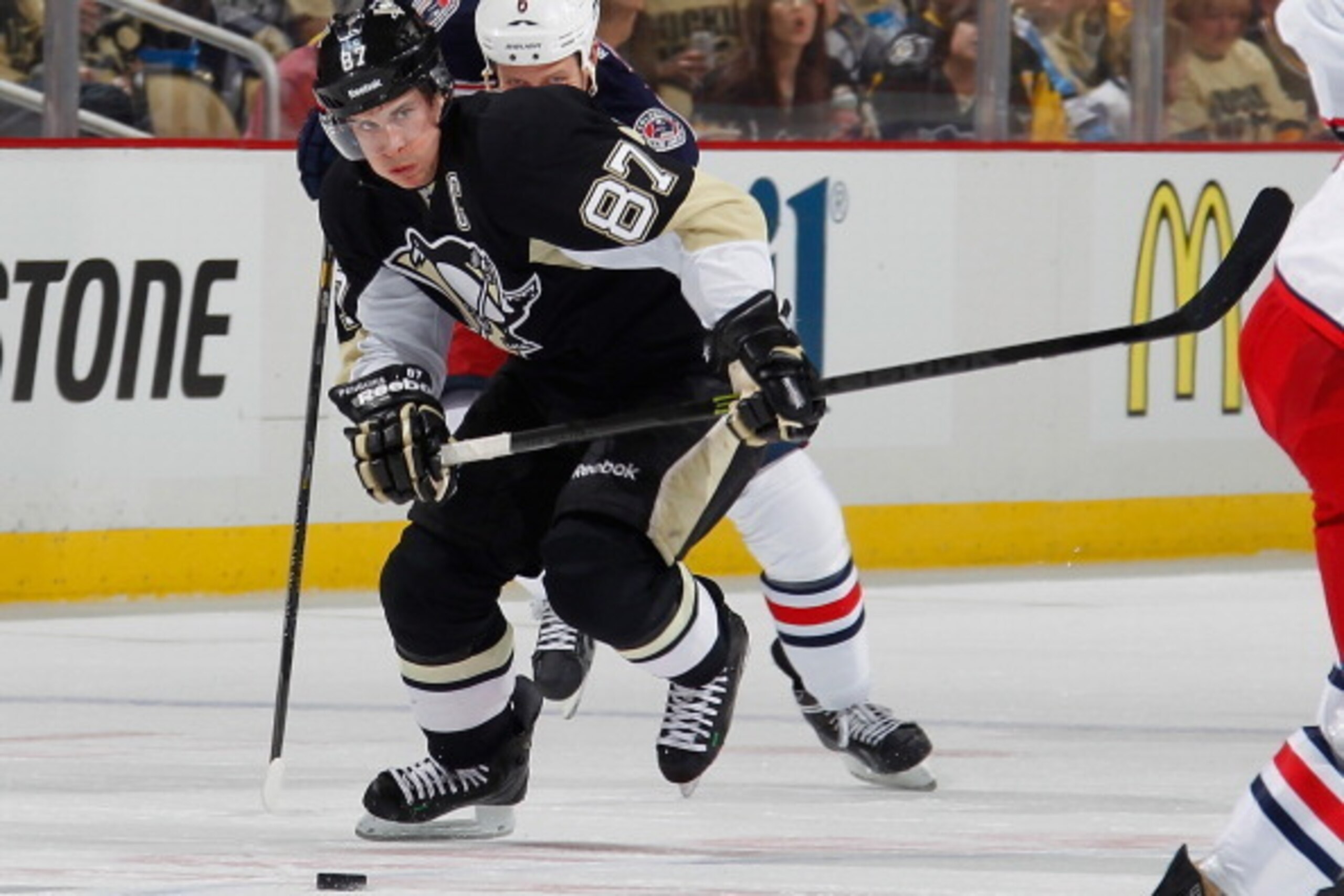 PITTSBURGH, PA - APRIL 16:  Sidney Crosby #87 of the Pittsburgh Penguins moves the puck up ice during the second period against the Columbus Blue Jackets on April 16 2014 at Consol Energy Center in Pittsburgh, Pennsylvania.  (Photo by Gregory Shamus/NHLI 