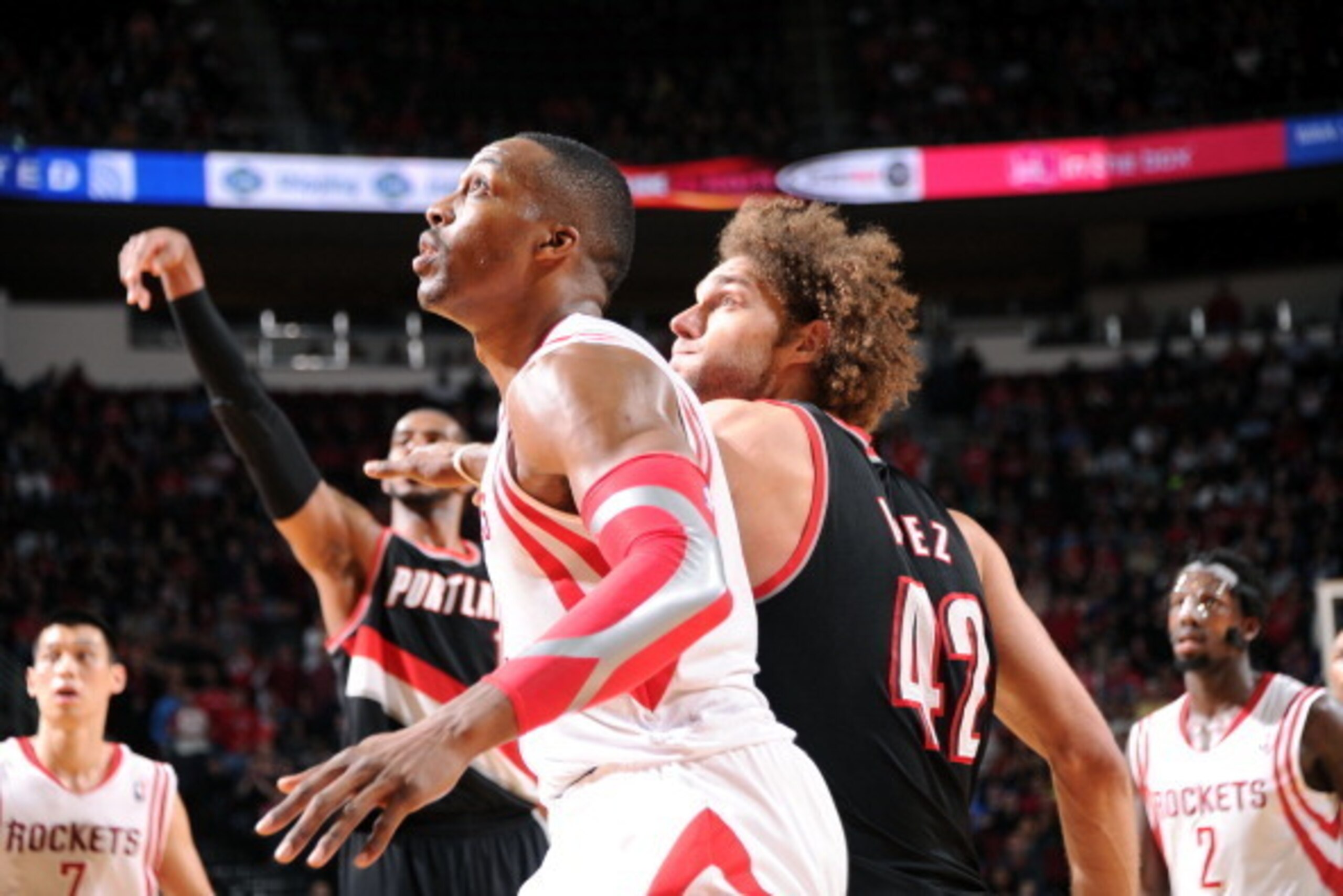 HOUSTON, TX - MARCH 9:  Dwight Howard #12 of the Houston Rockets battle for position against Robin Lopez #4 of the Portland Trail Blazers on March 9, 2014 at the Toyota Center in Houston, Texas. NOTE TO USER: User expressly acknowledges and agrees that, b