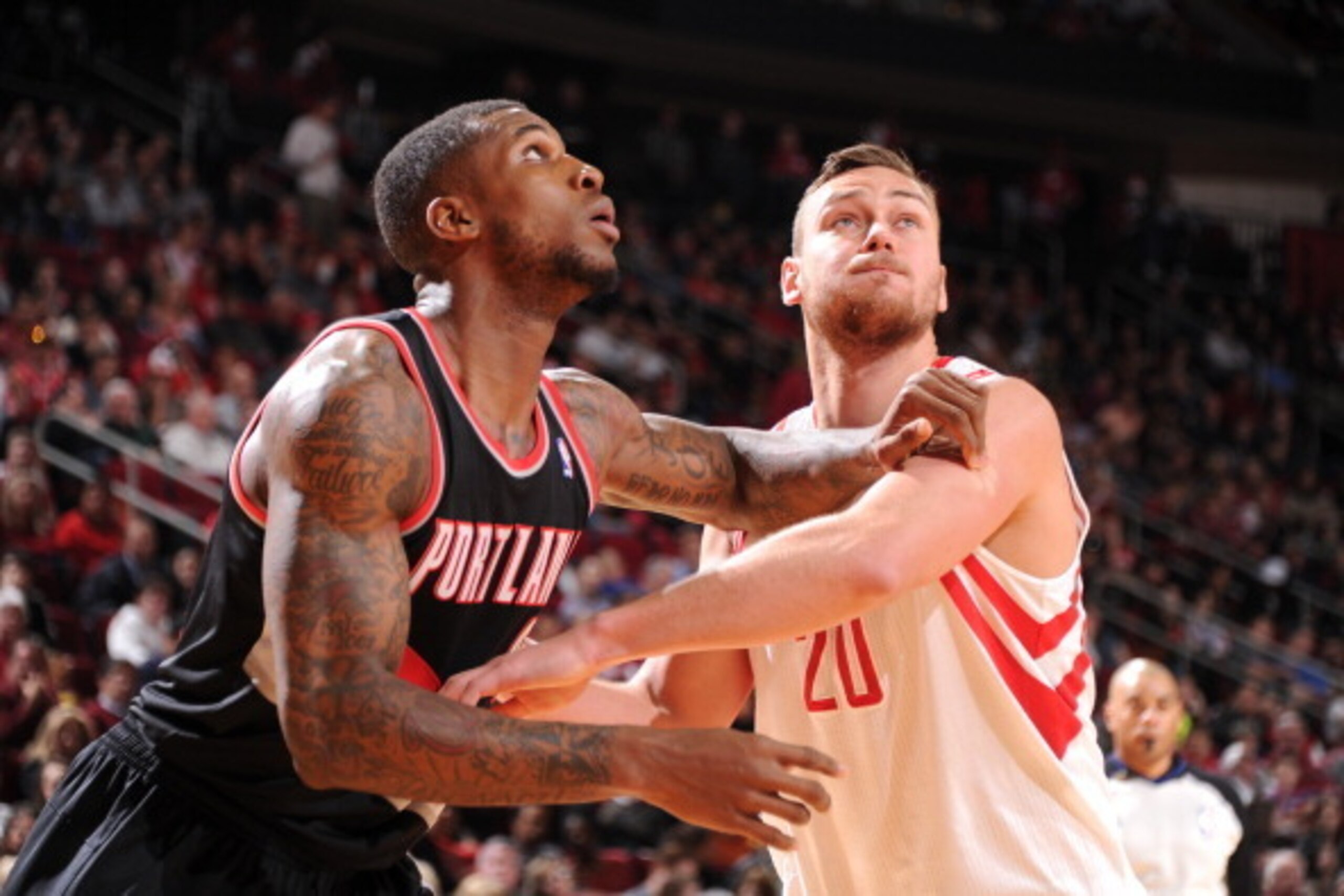 HOUSTON, TX - MARCH 9:  Thomas Robinson #41 of the Portland Trail Blazers and Donatas Motiejunas #20 of the Houston Rockets battle for the rebound on March 9, 2014 at the Toyota Center in Houston, Texas. NOTE TO USER: User expressly acknowledges and agree