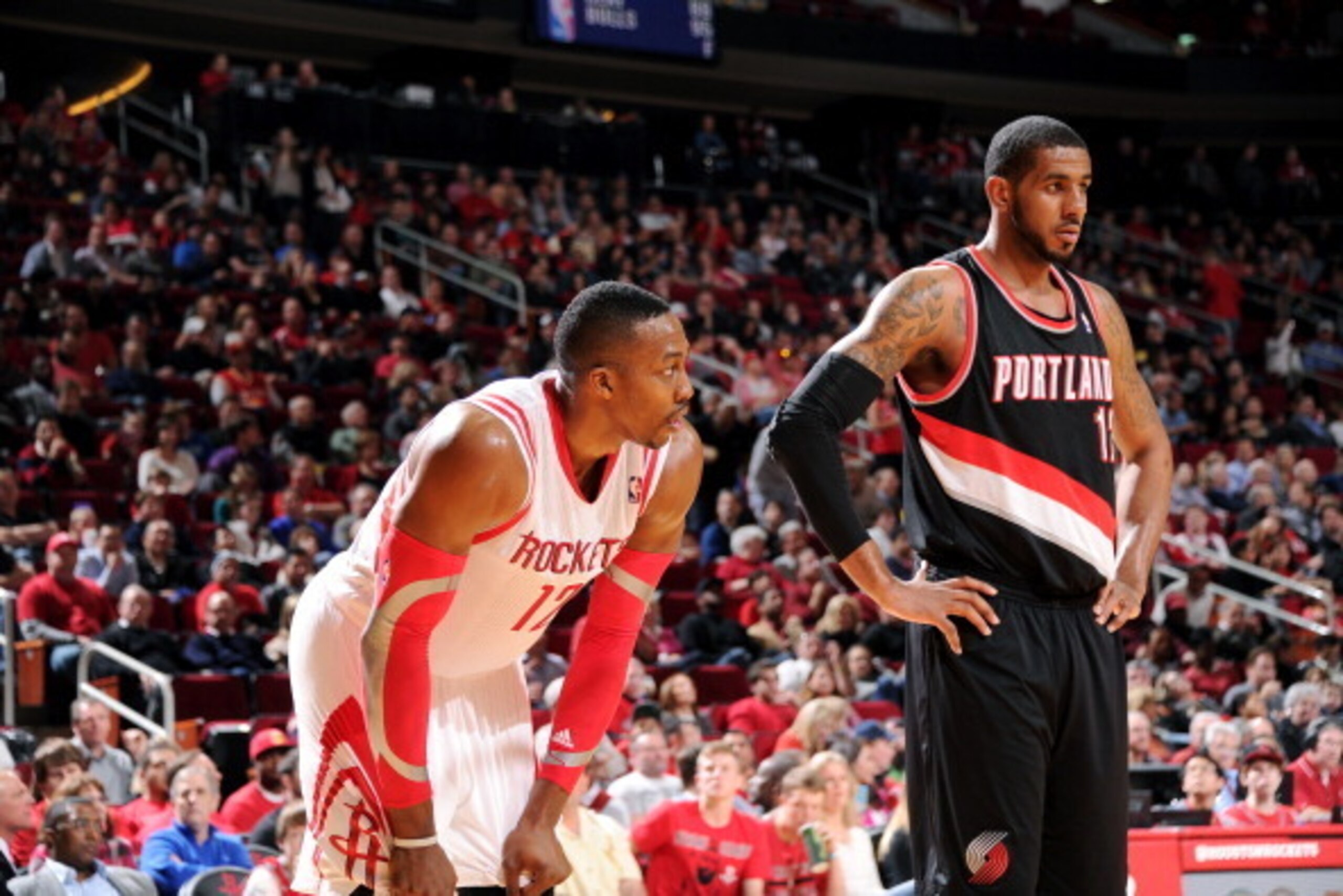 HOUSTON, TX - MARCH 9:  Dwight Howard #12 of the Houston Rockets battles for the rebound against LaMarcus Aldridge #12 of the Portland Trail Blazers on March 9, 2014 at the Toyota Center in Houston, Texas. NOTE TO USER: User expressly acknowledges and agr