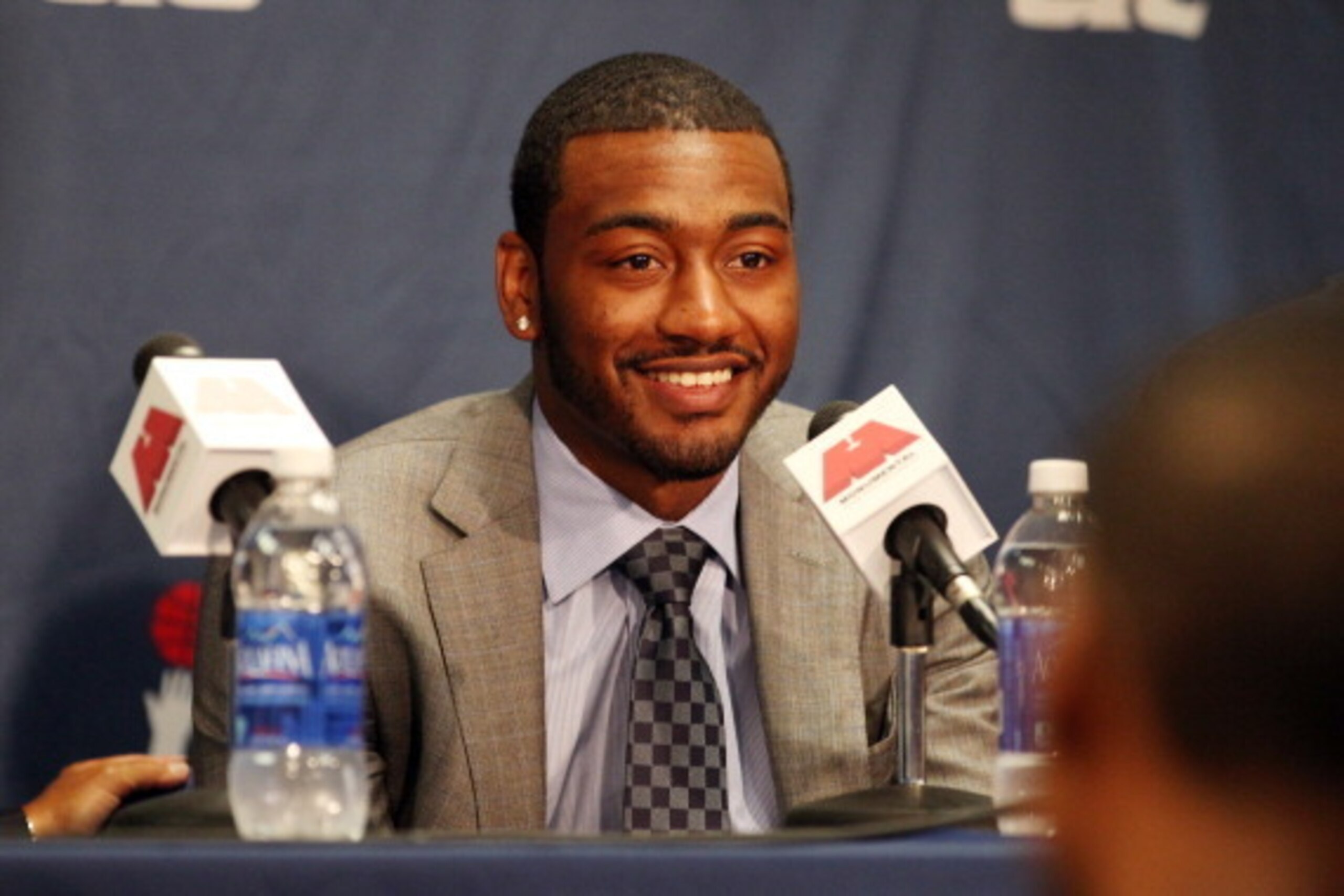 WASHINGTON, DC - AUGUST 1: John Wall #2 of the Washington Wizards speaks to the media during a press conference to announce a new contract at the Verizon Center on August 1, 2013 in Washington, DC. NOTE TO USER: User expressly acknowledges and agrees that