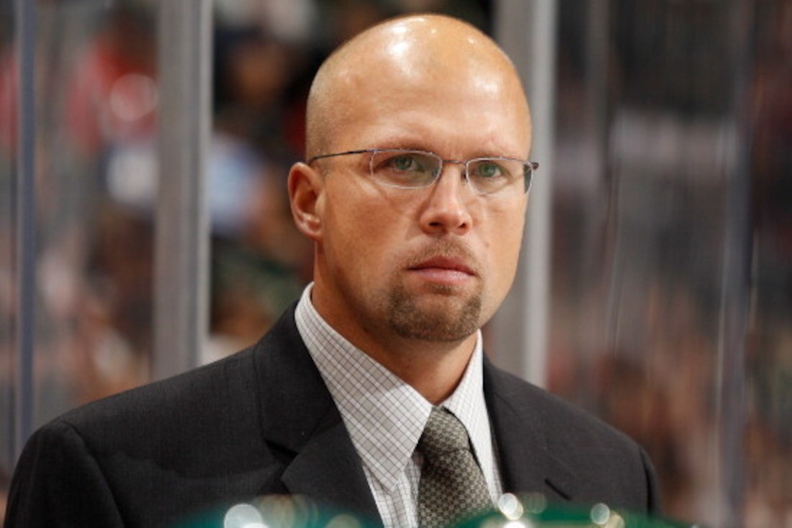 SAINT PAUL, MN - OCTOBER 15: Minnesota Wild Head Coach Mike Yeo stands behind the bench during the game against the Detroit Red Wings at the Xcel Energy Center on October 15, 2011 in Saint Paul, Minnesota. (Photo by Bruce Kluckhohn/NHLI via Getty Images)