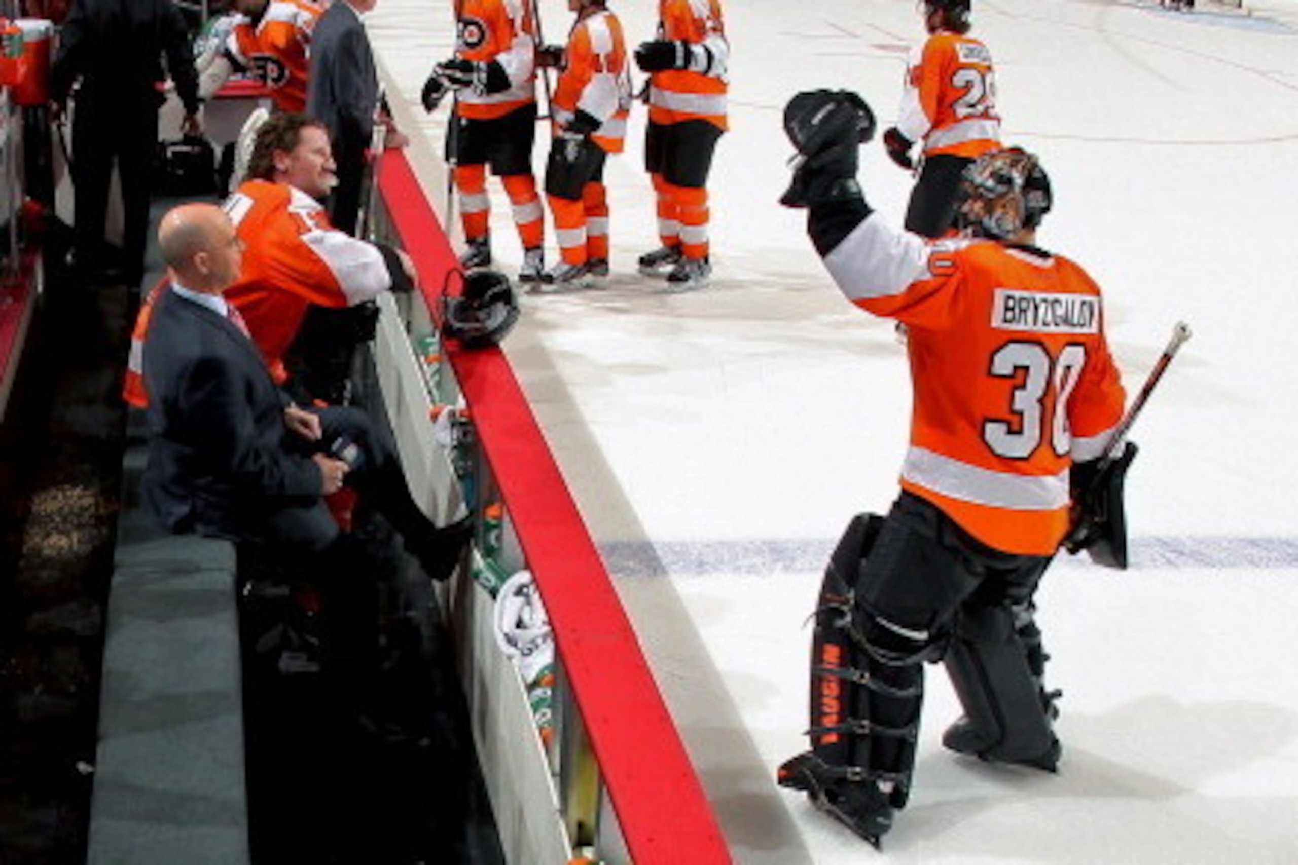 PHILADELPHIA, PA - MARCH 18:  Ilya Bryzgalov #30 congratulates Scott Hartnell #19 of the Philadelphia Flyers on his overtime winning goal against the Pittsburgh Penguins as he is being interview by Pierre McGuire on March 18, 2012 at the Wells Fargo Cente
