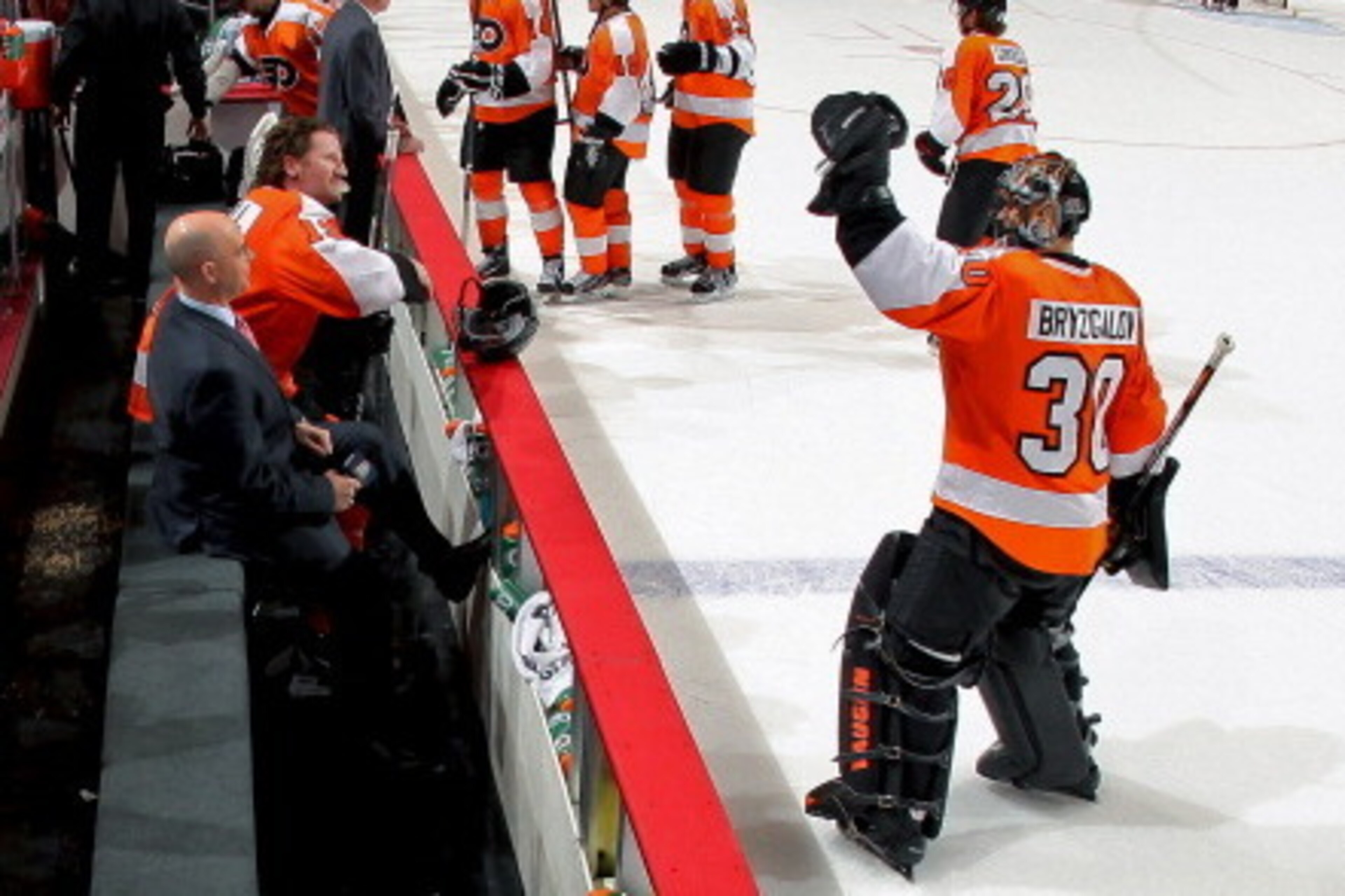PHILADELPHIA, PA - MARCH 18:  Ilya Bryzgalov #30 congratulates Scott Hartnell #19 of the Philadelphia Flyers on his overtime winning goal against the Pittsburgh Penguins as he is being interview by Pierre McGuire on March 18, 2012 at the Wells Fargo Cente