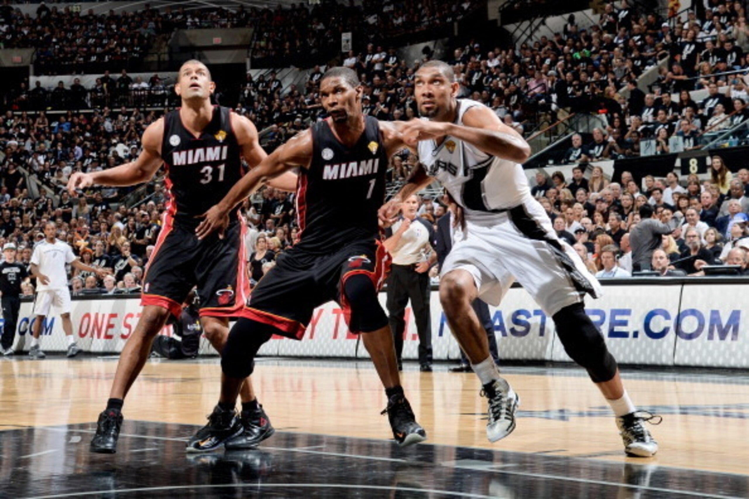 SAN ANTONIO, TX - JUNE 16: Tim Duncan #21 of the San Antonio Spurs battles for rebound position against Chris Bosh #1 and Shane Battier #31 of the Miami Heat during Game Five of the 2013 NBA Finals on June 16, 2013 at AT&T Center in San Antonio, Texas. NO