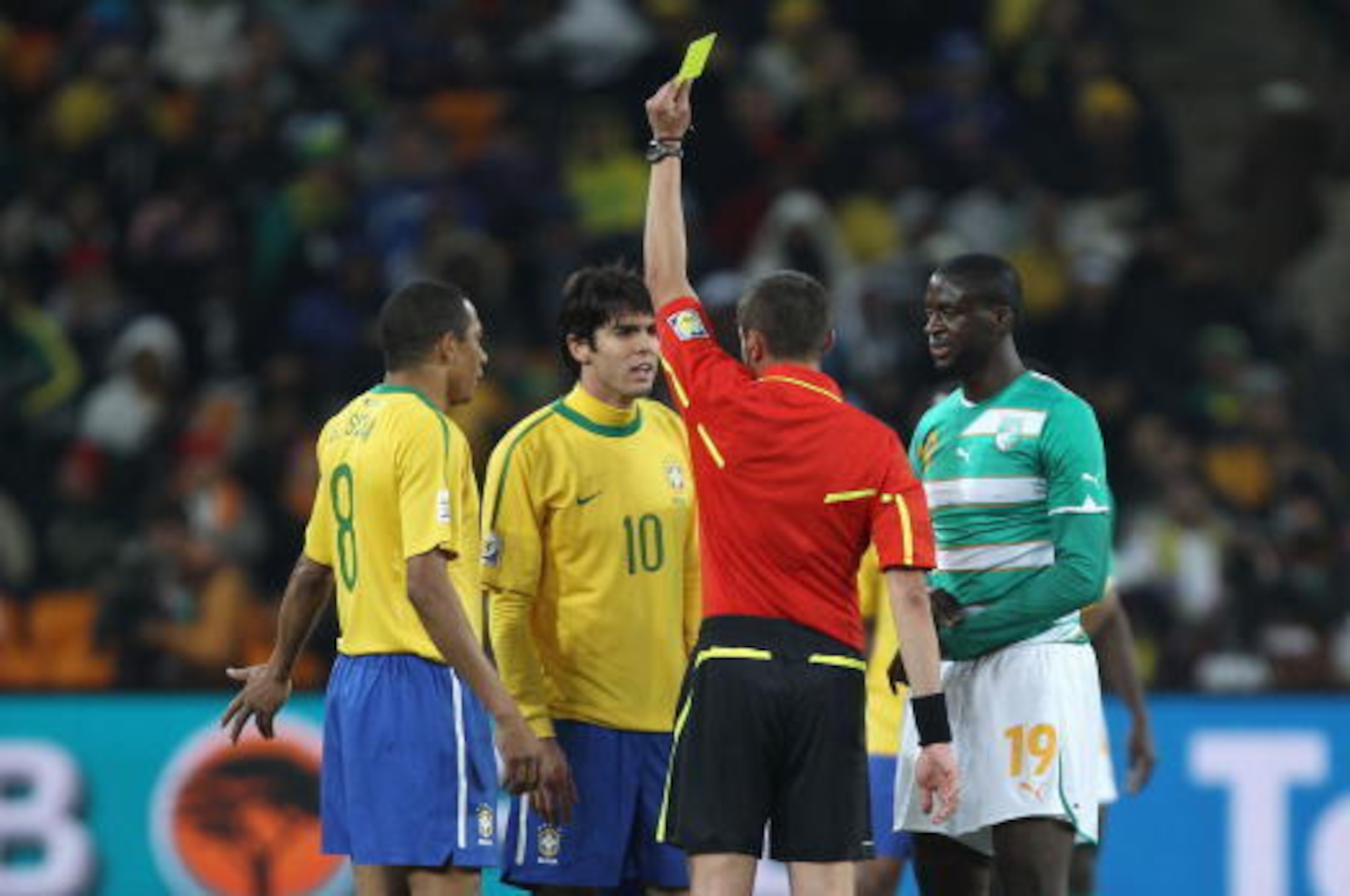 JOHANNESBURG, SOUTH AFRICA - JUNE 20:  Kaka of Brazil receives his first yellow card from referee Stephane Lannoy during the 2010 FIFA World Cup South Africa Group G match between Brazil and Ivory Coast at Soccer City Stadium on June 20, 2010 in Johannesb