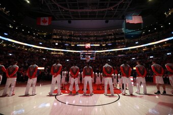 TORONTO,ON - APRIL 11:  The Toronto Raptors stand on the court before the game against the New York Knicks at the Air Canada Centre on April 11, 2014 in Toronto, Ontario, Canada. NOTE TO USER: User expressly acknowledges and agrees that, by downloading an