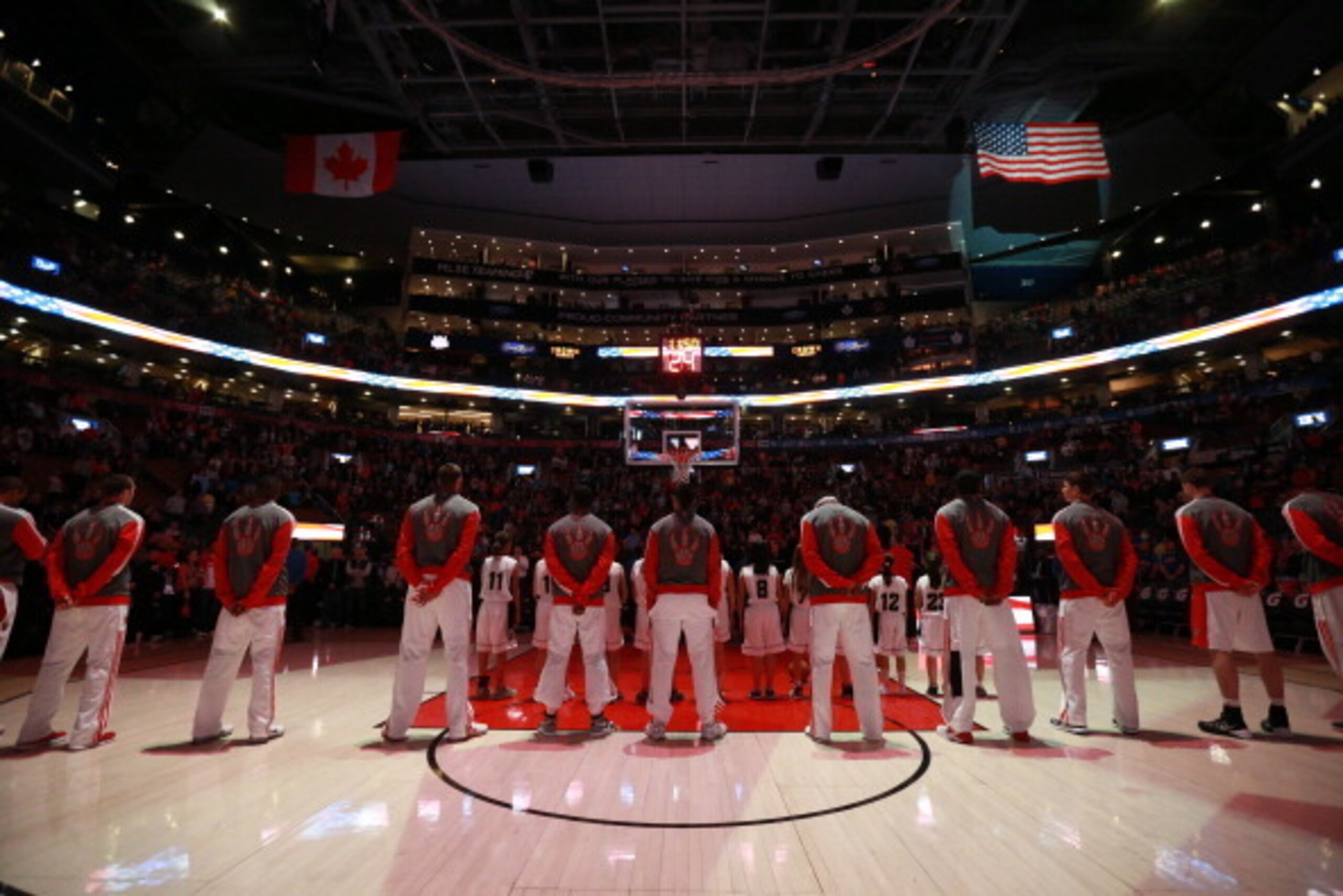 TORONTO,ON - APRIL 11: The Toronto Raptors stand on the court before the game against the New York Knicks at the Air Canada Centre on April 11, 2014 in Toronto, Ontario, Canada. NOTE TO USER: User expressly acknowledges and agrees that, by downloading an TORONTO,ON - APRIL 11: The Toronto Raptors stand on the court before the game against the New York Knicks at the Air Canada Centre on April 11, 2014 in Toronto, Ontario, Canada. NOTE TO USER: User expressly acknowledges and agrees that, by downloading an