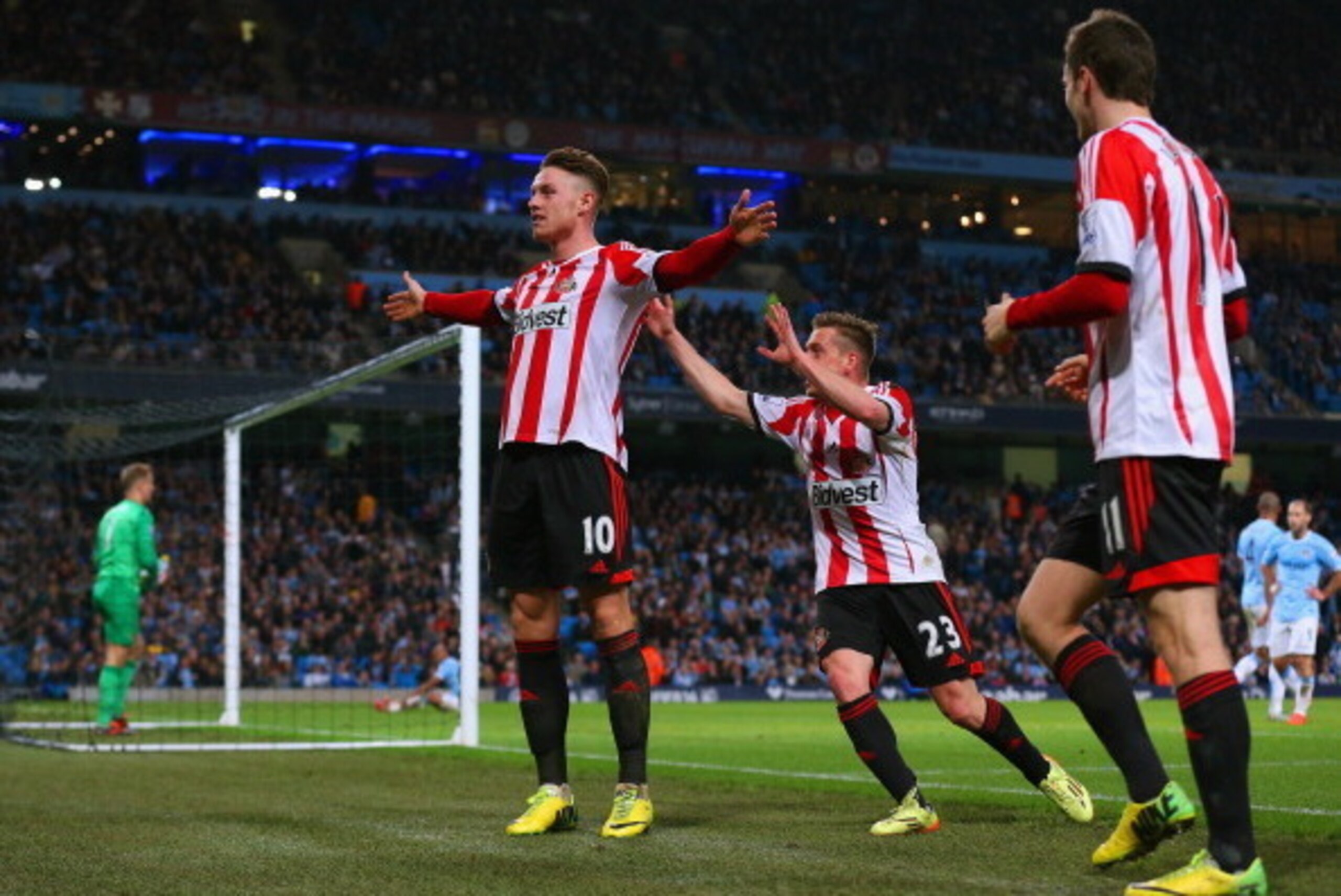 MANCHESTER, ENGLAND - APRIL 16:  Connor Wickham of Sunderland celebrates scoring their second goal with Emanuele Giaccherini of Sunderland  during the Barclays Premier League match between Manchester City and Sunderland at Etihad Stadium on April 16, 2014