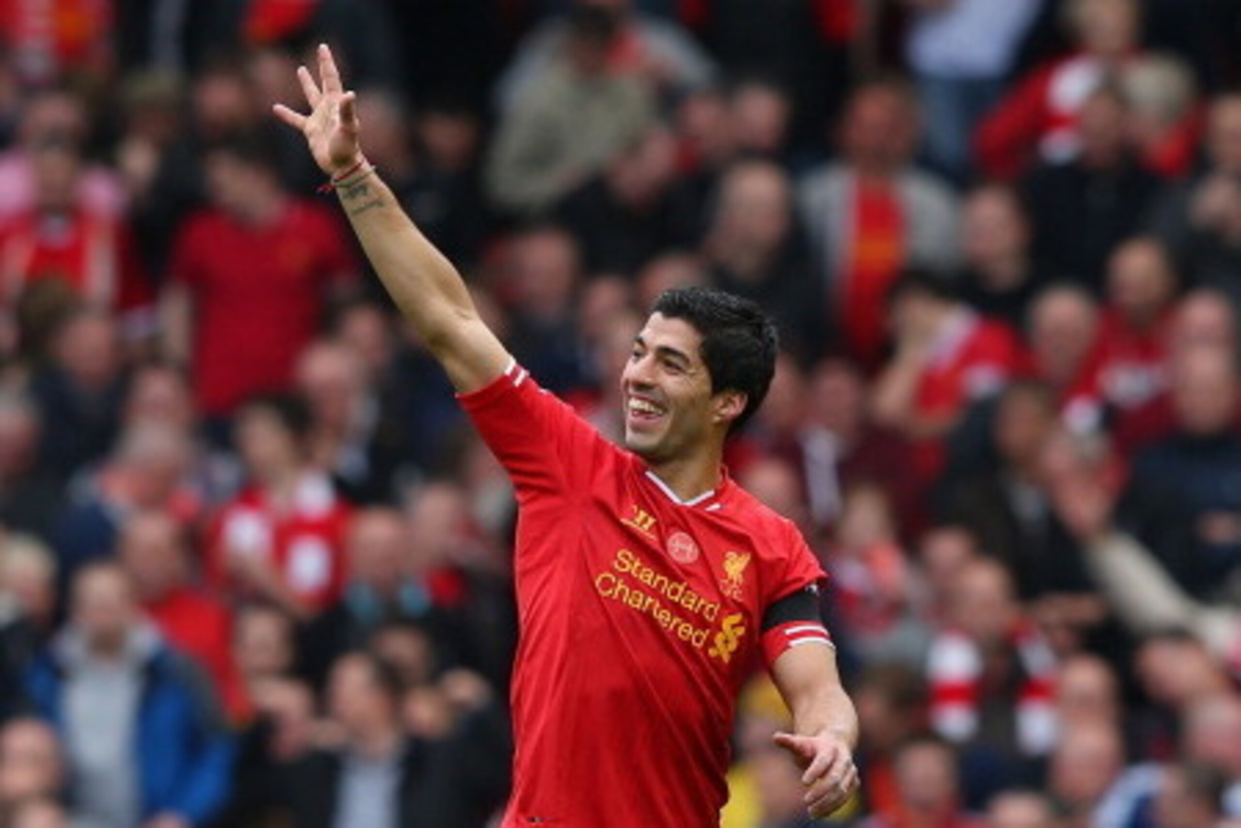 LIVERPOOL, ENGLAND - APRIL 13:  Luis Suarez of Liverpool celebrates at the end of the Barclays Premier League match between Liverpool and Manchester City at Anfield on April 13, 2014 in Liverpool, England.  (Photo by Alex Livesey/Getty Images)