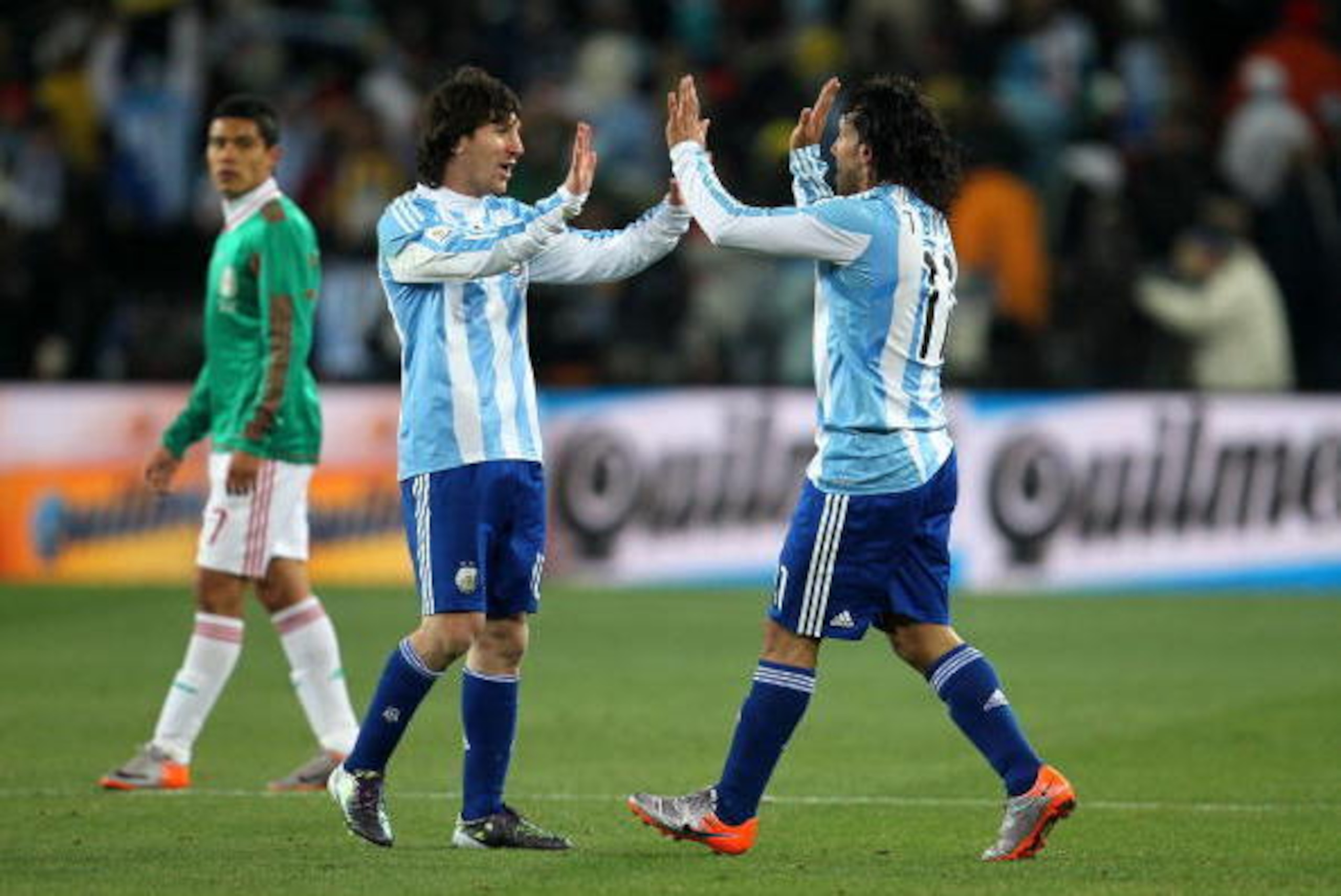JOHANNESBURG, SOUTH AFRICA - JUNE 27:  Carlos Tevez of Argentina celebrates scoring his second goal and his side's third with team mate Lionel Messi during the 2010 FIFA World Cup South Africa Round of Sixteen match between Argentina and Mexico at Soccer 