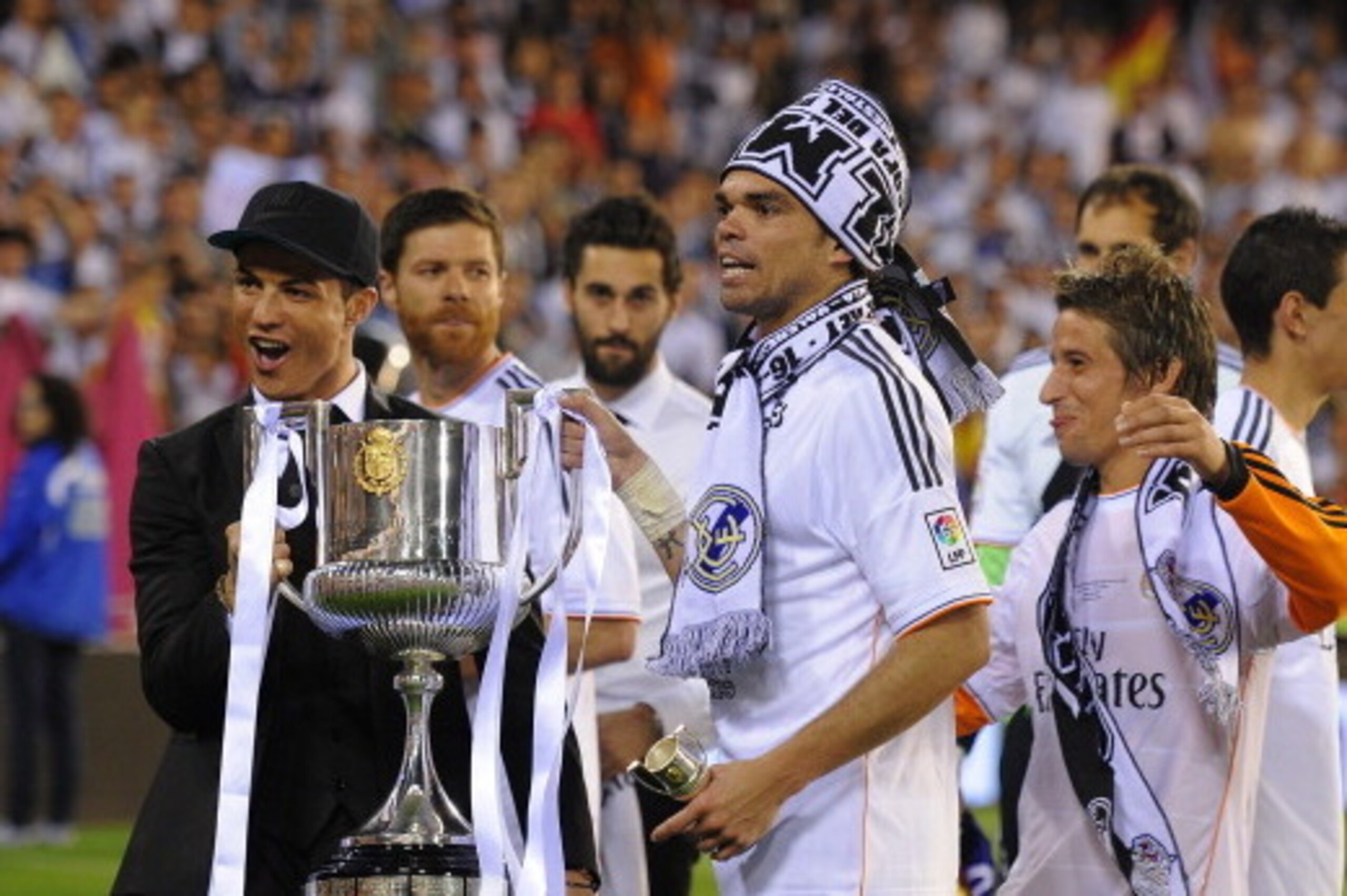 VALENCIA, SPAIN - APRIL 16:  (From L-R) Cristiano Ronaldo, Pepe and Fabio Coentrao hold the Copa del Rey trophy after beating Barcelona 2-1 in the final at Estadio Mestalla on April 16, 2014 in Valencia, Spain.  (Photo by Denis Doyle/Getty Images)
