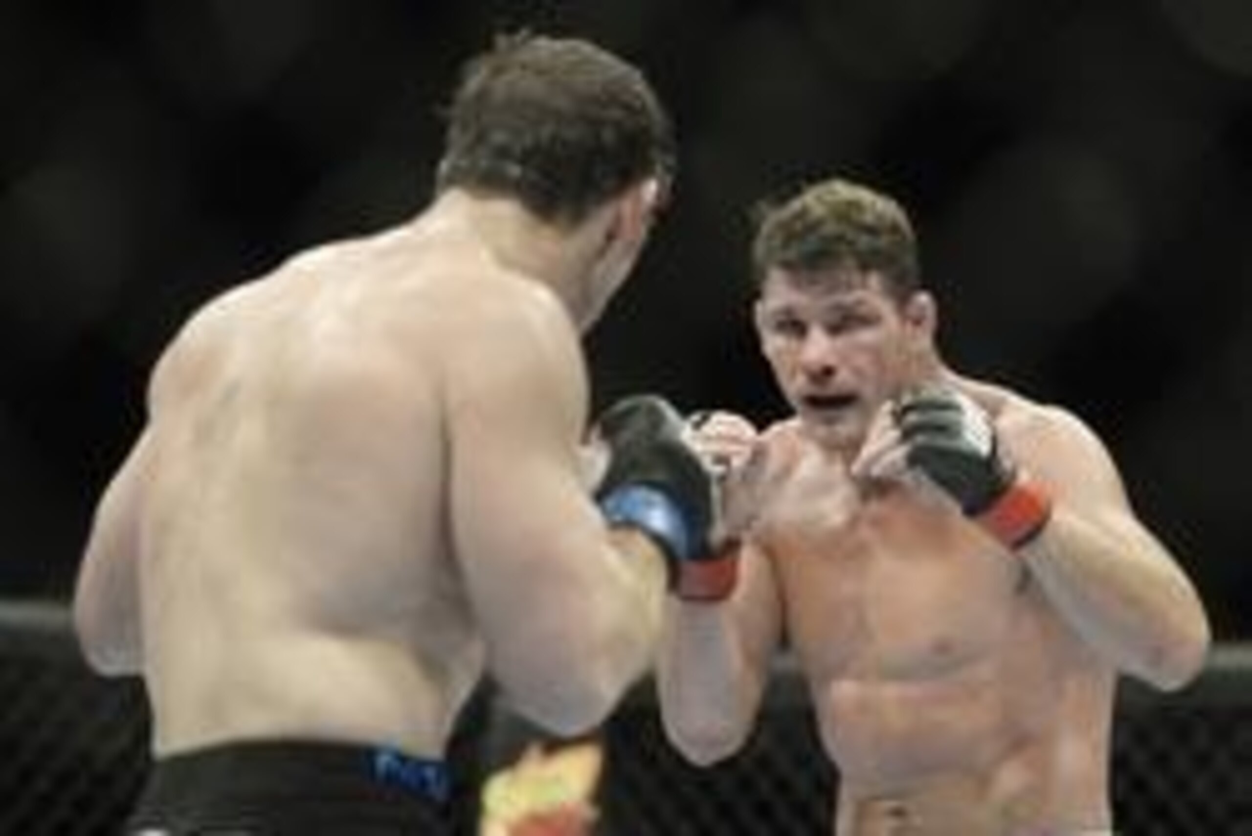 Apr 16, 2014; Quebec City, Quebec, Canada; Michael Bisping (red gloves) fights against Tim Kennedy (blue gloves) during their middleweight bout at Colisee Pepsi. Mandatory Credit: Eric Bolte-USA TODAY Sports