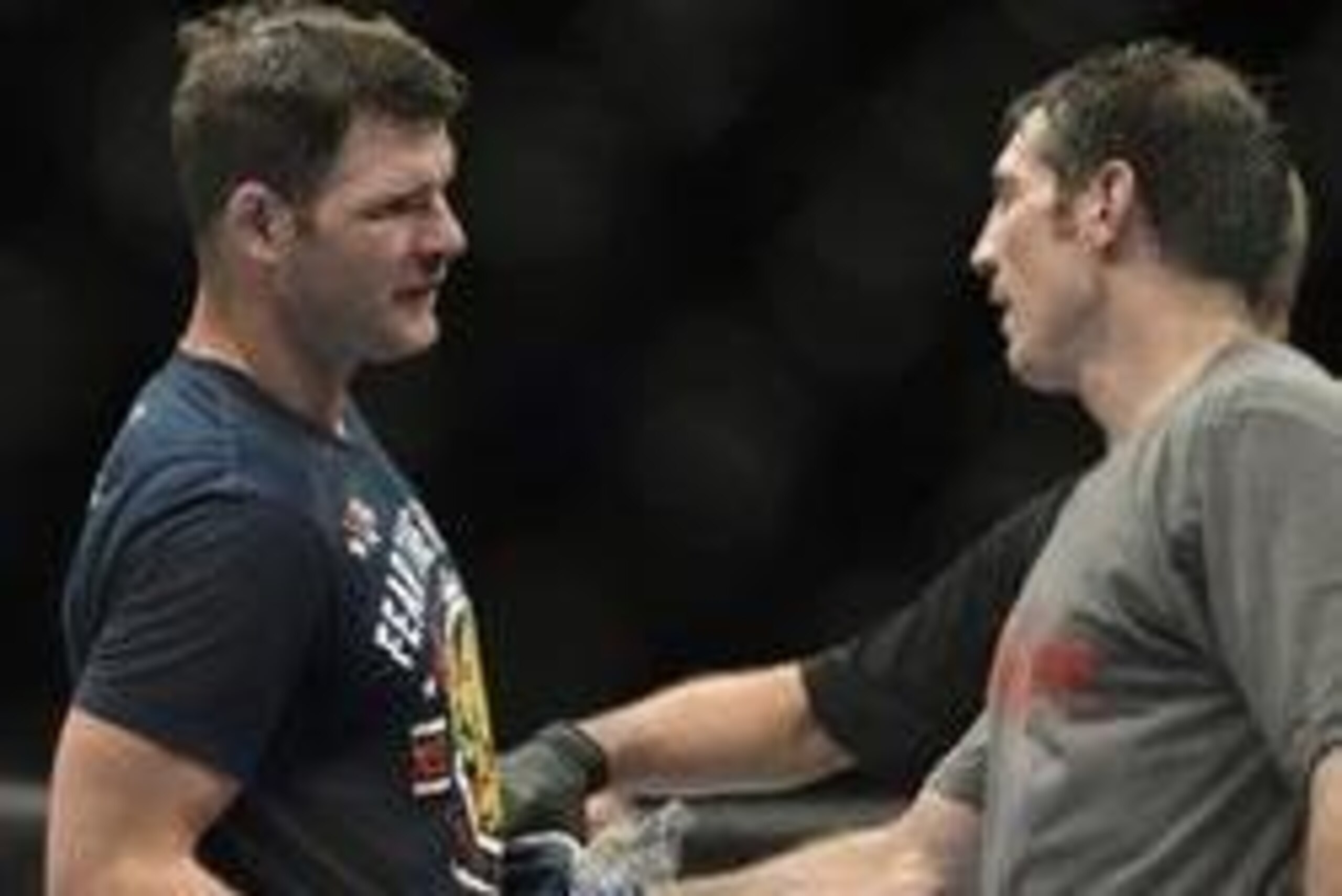 Apr 16, 2014; Quebec City, Quebec, Canada; Michael Bisping (red gloves) shakes hands with Tim Kennedy (blue gloves) after their middleweight bout at Colisee Pepsi. Mandatory Credit: Eric Bolte-USA TODAY Sports