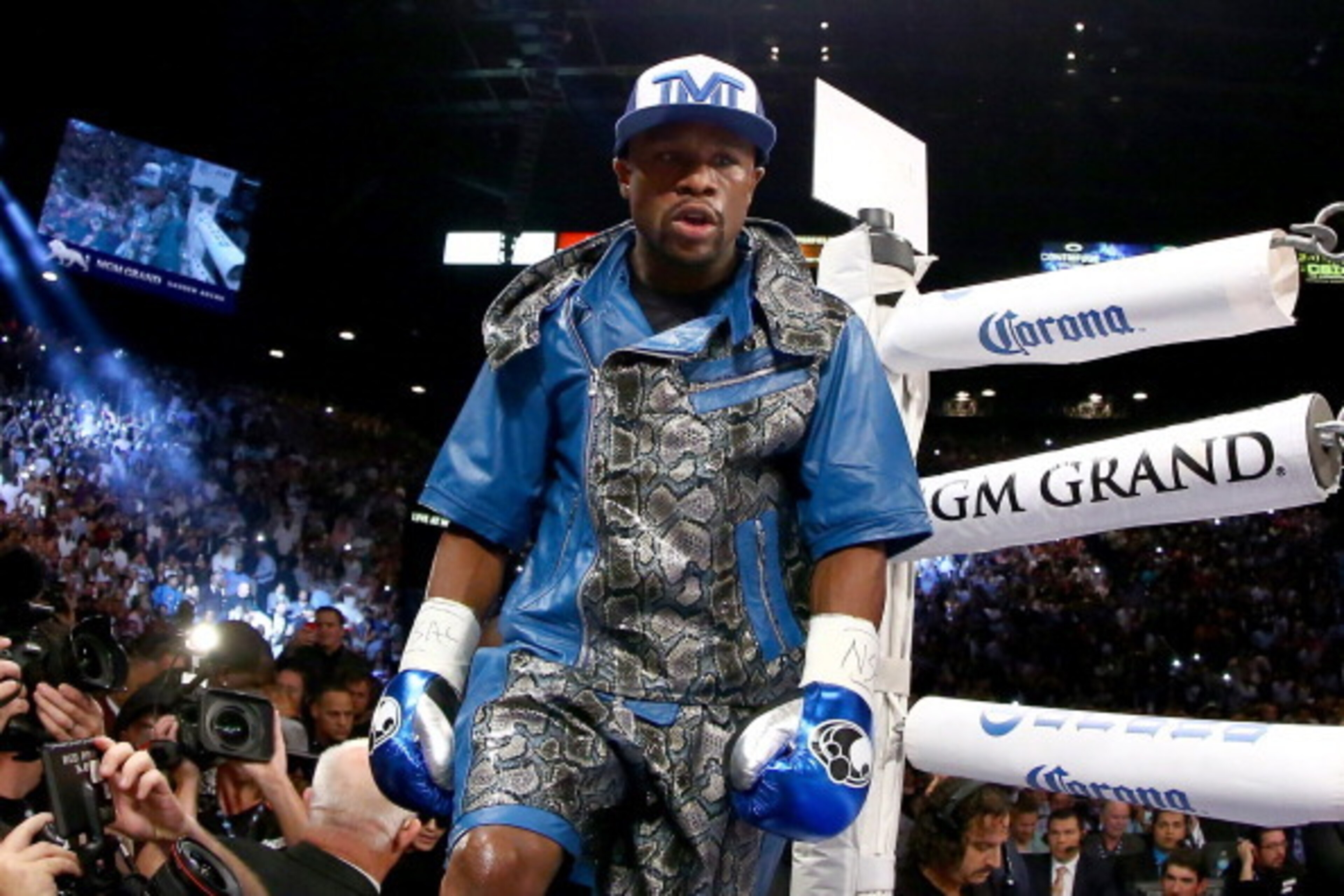 LAS VEGAS, NV - SEPTEMBER 14: Floyd Mayweather Jr. enters the ring to take on Canelo Alvarez in their WBC/WBA 154-pound title fight at the MGM Grand Garden Arena on September 14, 2013 in Las Vegas, Nevada. (Photo by Al Bello/Getty Images) LAS VEGAS, NV - SEPTEMBER 14: Floyd Mayweather Jr. enters the ring to take on Canelo Alvarez in their WBC/WBA 154-pound title fight at the MGM Grand Garden Arena on September 14, 2013 in Las Vegas, Nevada. (Photo by Al Bello/Getty Images)