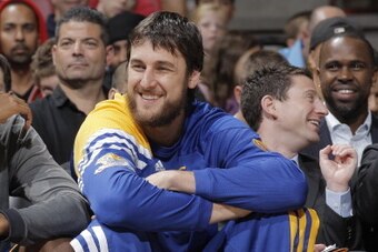 SACRAMENTO, CA - OCTOBER 17:  Andrew Bogut #12 of the Golden State Warriors enjoying the game against the Sacramento Kings from the bench on October 17, 2012 at Power Balance Pavilion in Sacramento, California. NOTE TO USER: User expressly acknowledges an