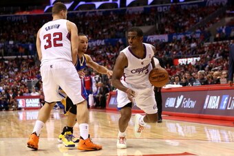 LOS ANGELES, CA - OCTOBER 31:  Chris Paul #3 of the Los Angeles Clippers drives as Blake Griffin #32 sets a screen against Stephen Curry #30 of the Golden State Warriors at Staples Center on October 31, 2013 in Los Angeles, California. The Clippers won 12