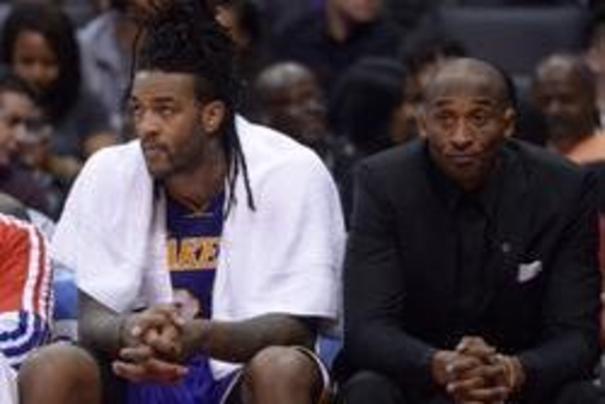 Jan 10, 2014; Los Angeles, CA, USA; Los Angeles Lakers players Jordan Hill (left) and Kobe Bryant react during the game against the Los Angeles Clippers at Staples Center. The Clippers defeated the Lakers 123-87. Mandatory Credit: Kirby Lee-USA TODAY Spor