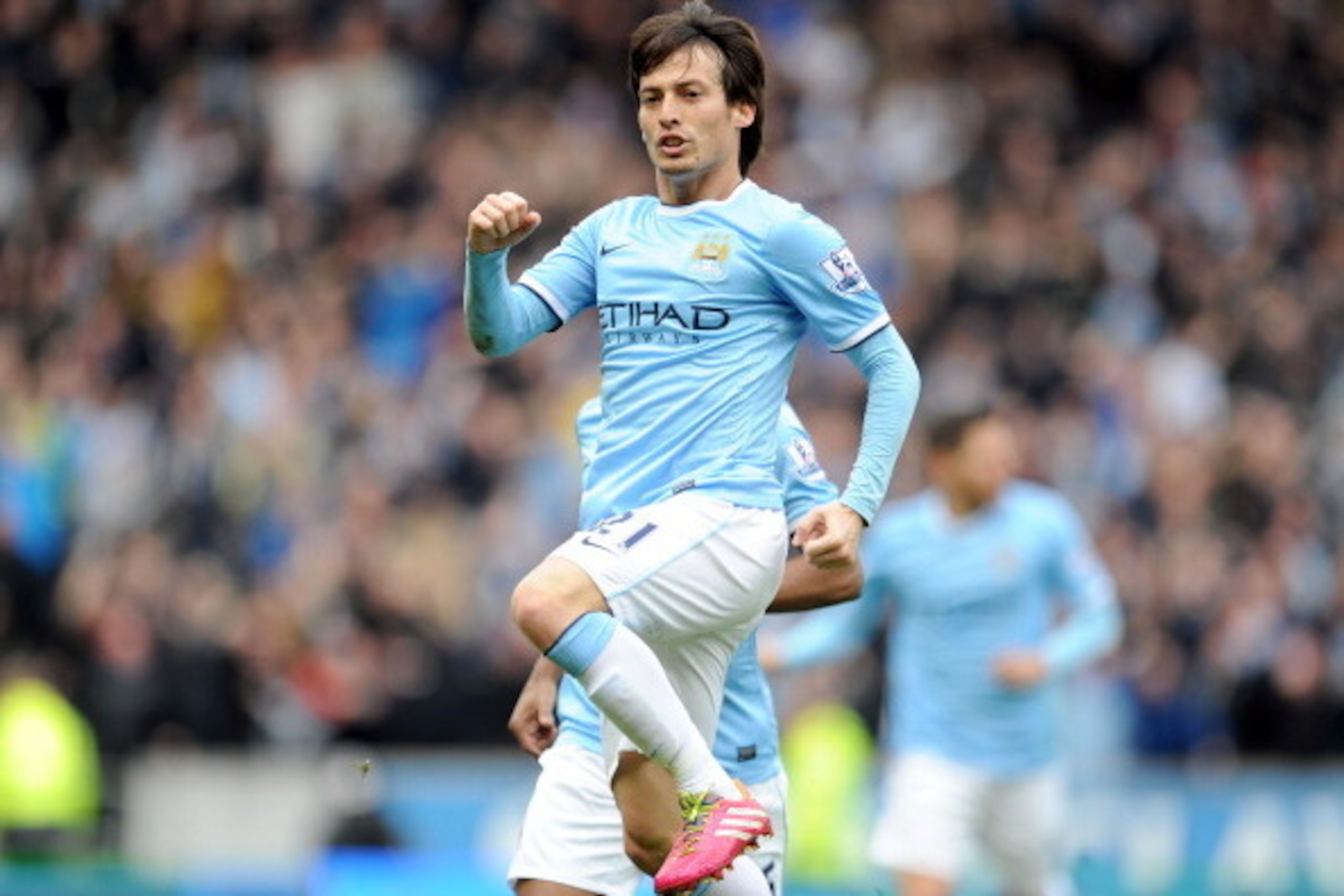 HULL, ENGLAND - MARCH 15:  David Silva of Manchester City celebrates after he scores the first goal of the game for his side during the Barclays Premier League match between Hull City and Manchester City at the KC Stadium on March 15, 2014 in Hull, Englan