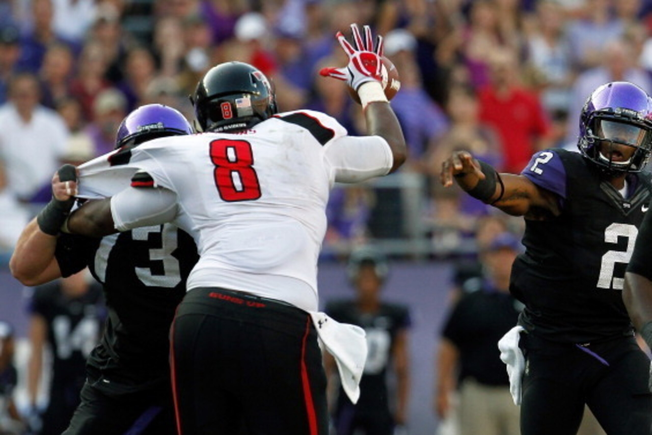 FORT WORTH, TX - OCTOBER 20:  Trevone Boykin #2 of the TCU Horned Frogs has a pass broken up by Delvon Simmons #8 of the Texas Tech Red Raiders at Amon G. Carter Stadium on October 20, 2012 in Fort Worth, Texas. The Texas Tech Red Raiders beat the TCU Hor