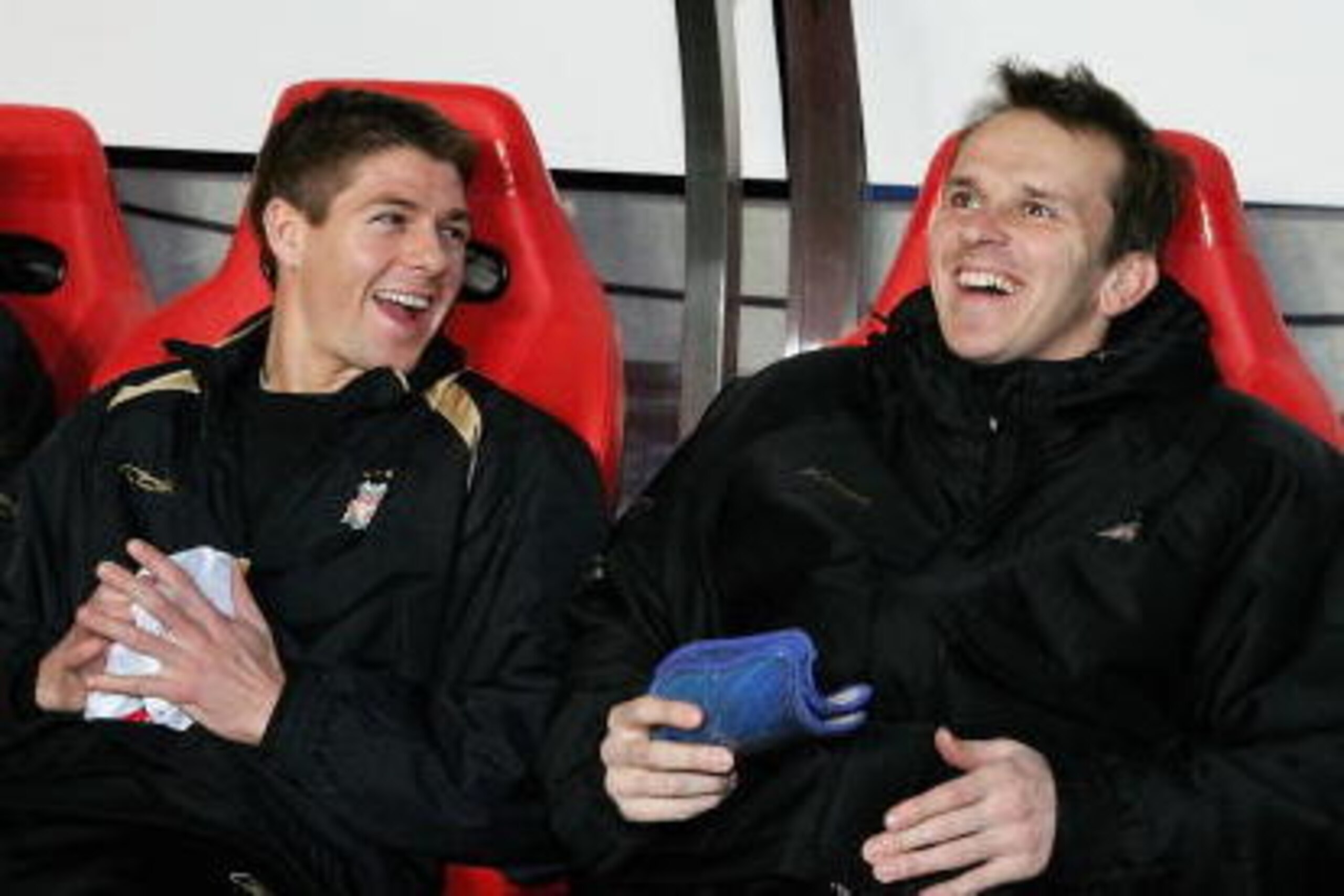 LISBON, PORTUGAL - FEBRUARY 21: Steven Gerrard of Liverpool shares a joke with Dietmar Hamann on the subs bench, before the UEFA Champions League round of 16, first leg match between Benfica and Liverpool on February 21, 2006 at the Stadium of Light in Li