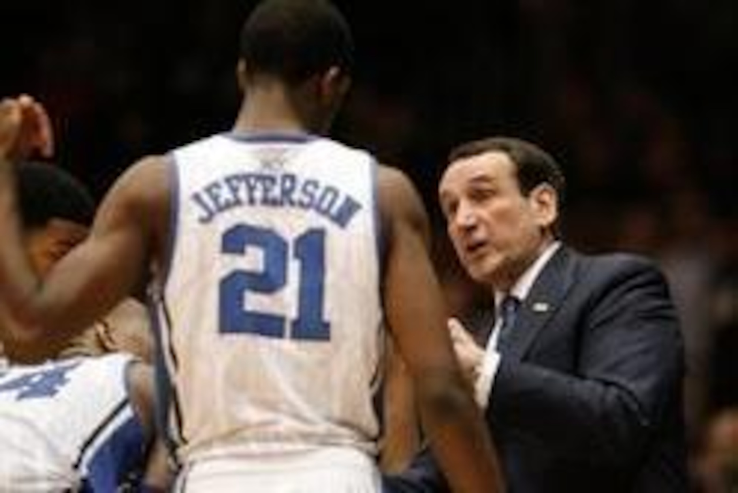 Feb 4, 2014; Durham, NC, USA; Duke Blue Devils head coach Mike Krzyzewski talks to forward Amile Jefferson (21) during a timeout against the Wake Forest Demon Deacons at Cameron Indoor Stadium. Mandatory Credit: Mark Dolejs-USA TODAY Sports