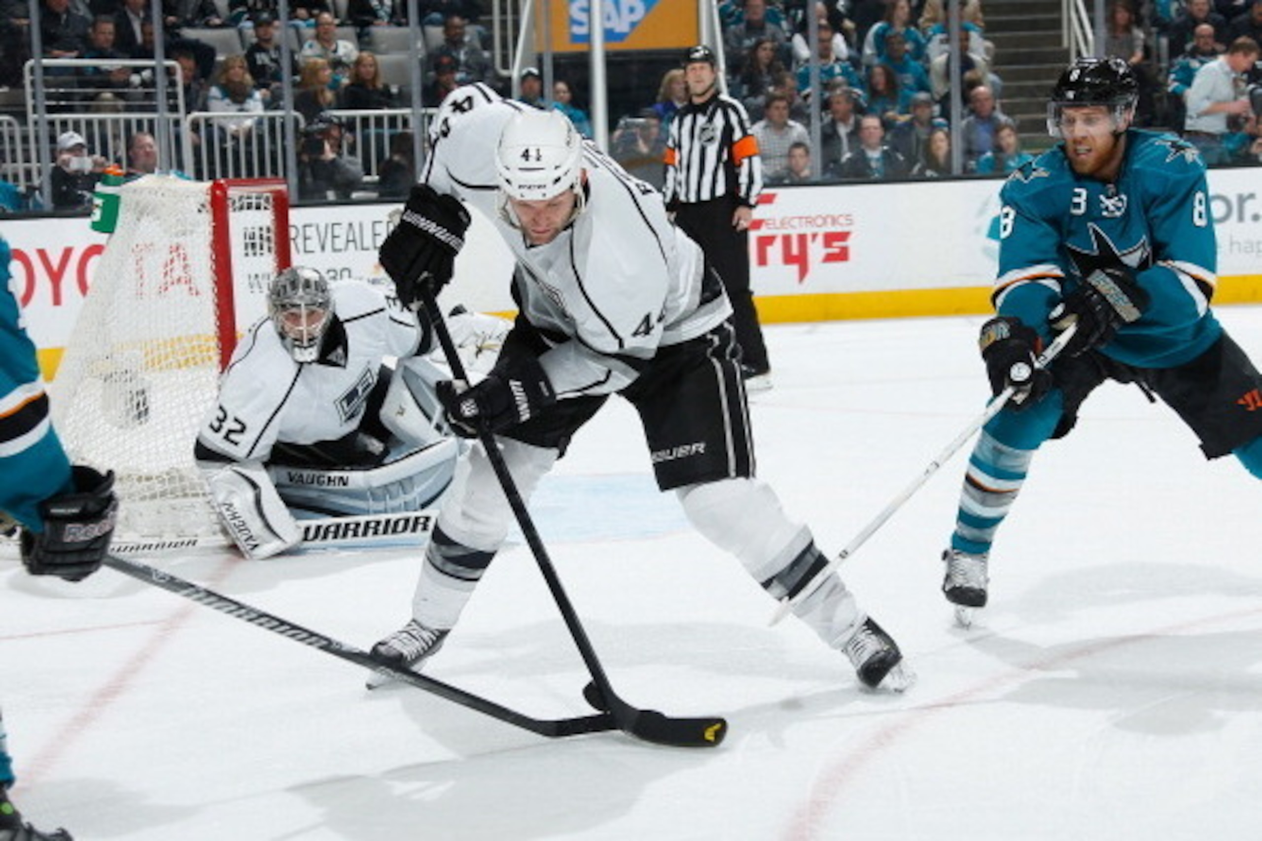 SAN JOSE, CA - JANUARY 27: Joe Pavelski #8 of the San Jose Sharks skates after the puck against Robyn Regehr #44 and Jonathan Quick #32 of the Los Angeles Kings during an NHL game on January 27, 2014 at SAP Center in San Jose, California. (Photo by Don Sm