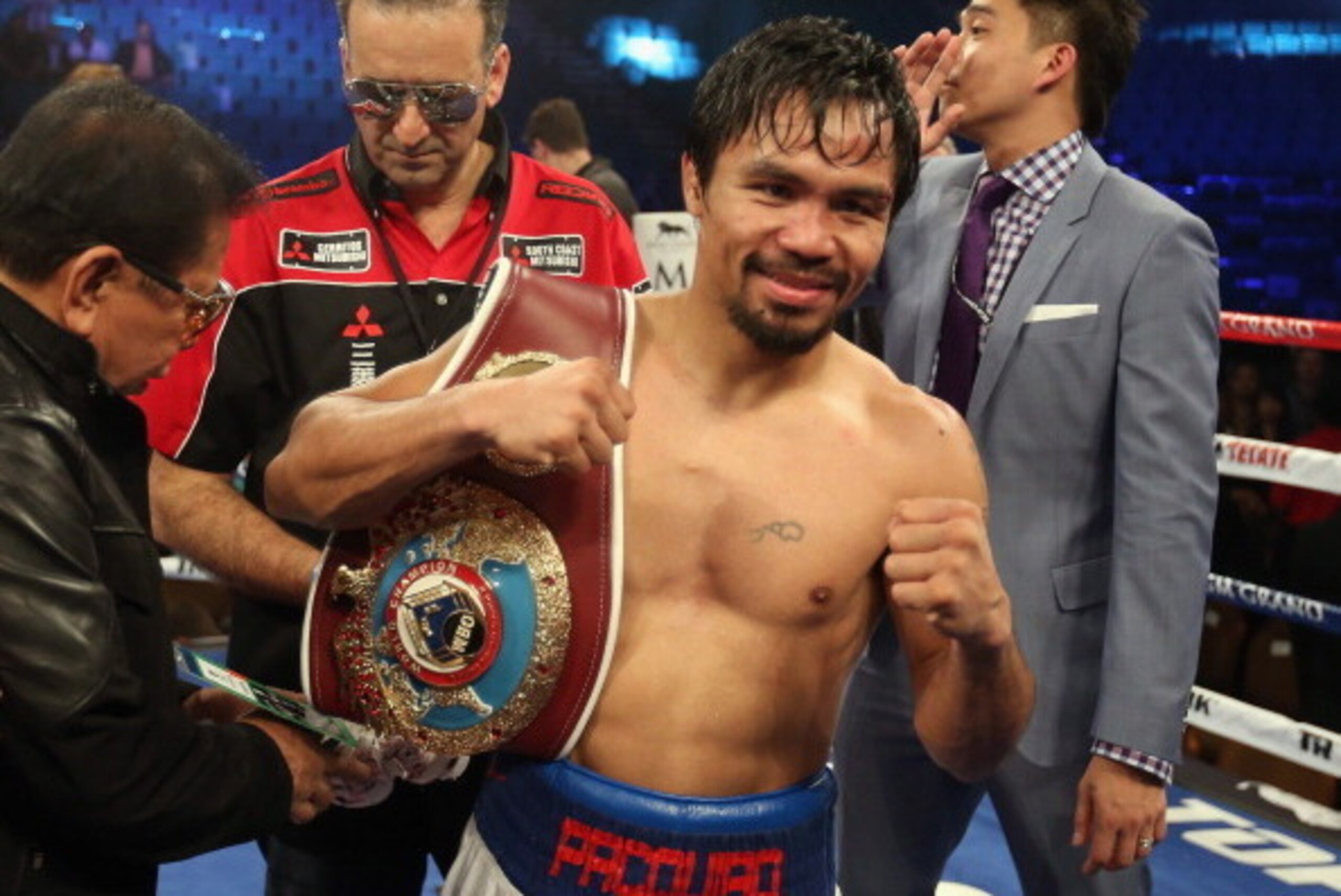 LAS VEGAS, NV - APRIL 12:  Manny Pacquiao celebrates his victory over Timothy Bradley at the MGM Grand Garden Arena on April 12, 2014 in Las Vegas, Nevada.  (Photo by Jeff Gross/Getty Images)