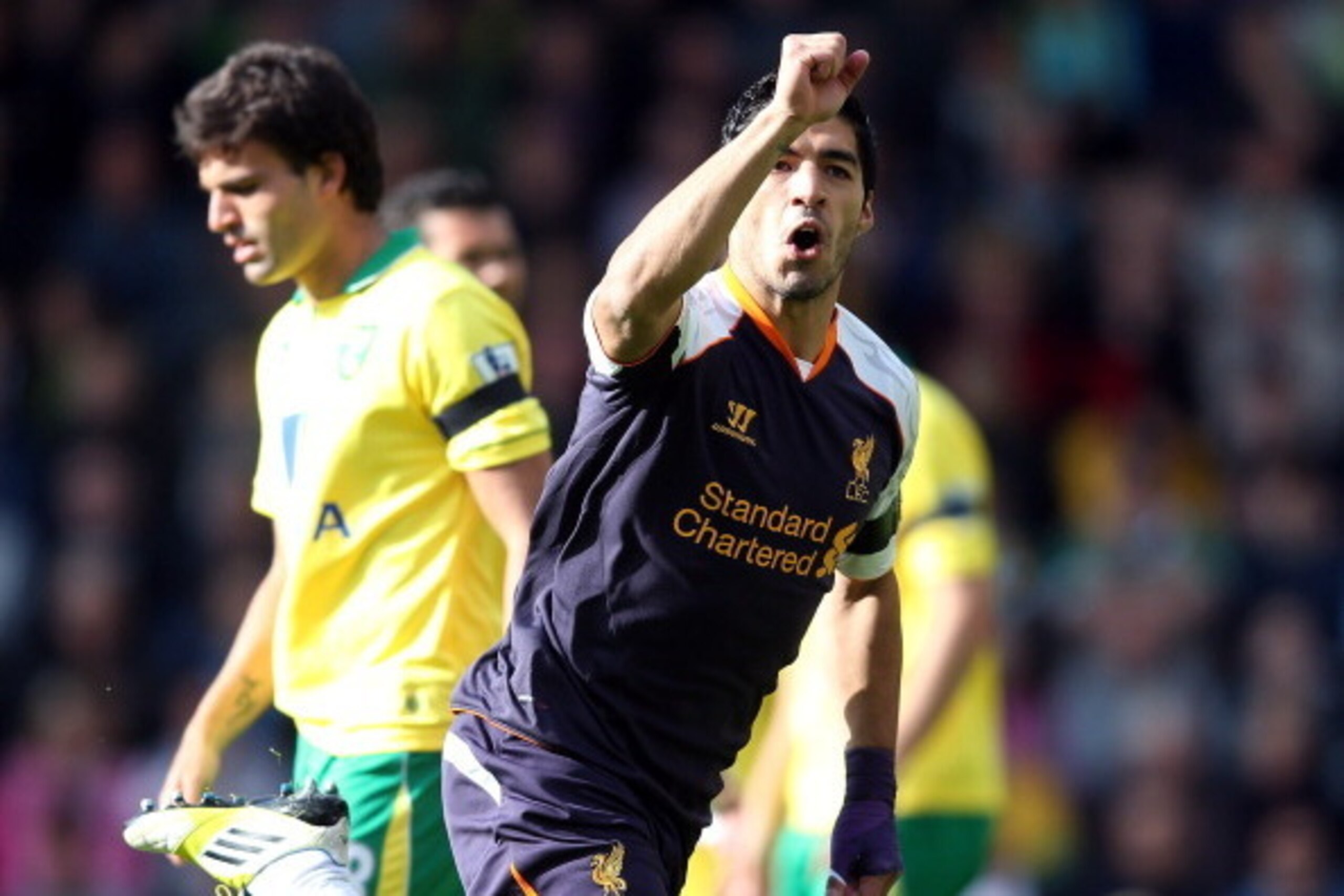 NORWICH, ENGLAND - SEPTEMBER 29:  Luis Suarez of Liverpool celebrates scoring his second goal during the Barclays Premier League match between Norwich City and Liverpool at Carrow Road on September 29, 2012 in Norwich, England.  (Photo by Julian Finney/Ge