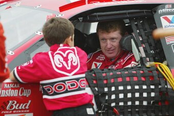 LONG POND, PA - JULY 28:  Bill Elliott, driver of the #9 Evernham Motorsports Dodge Intrepid R/T, talks with son Chase during the NASCAR Winston Cup Series Pennsylavania 500 on July 28, 2002 at Pocono Raceway in Long Pond, Pennsylvania.  (Photo by Jamie S