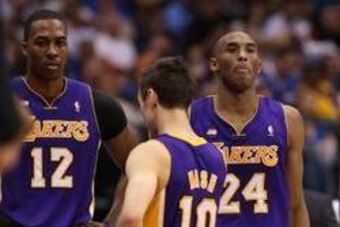 Feb 24, 2013; Dallas, TX, USA;  Los Angeles Lakers guard Steve Nash (10) speaks with center Dwight howard and guard Kobe Bryant (24) during the game agains the Dallas Mavericks at the American Airlines Center. The Lakers beat the Mavs 103-99. Mandatory Cr