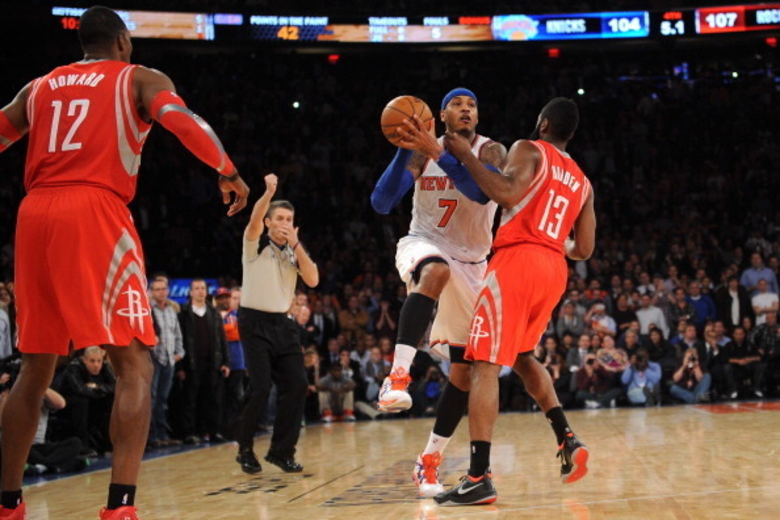 NEW YORK, NY - NOVEMBER 14: A personal foul is called on James Harden #13 of the Houston Rockets while  Carmelo Anthony #7 of the New York Knicks  takes a shot with five seconds left in the game at Madison Square Garden on November 14, 2013 in New York Ci