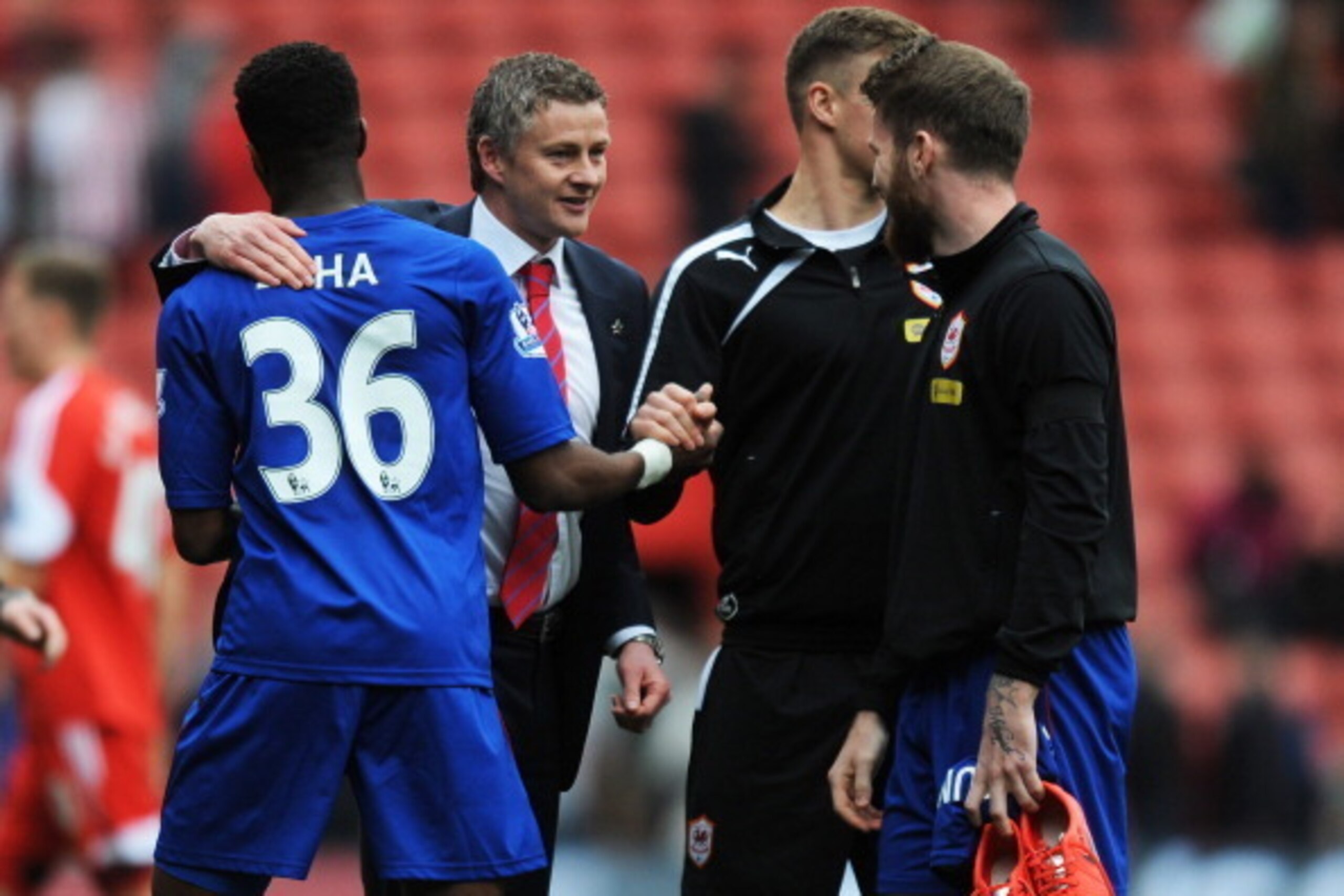 SOUTHAMPTON, ENGLAND - APRIL 12:  Ole Gunnar Solskjaer the Cardiff manager congratulates his players following their team's victory during the Barclays Premier League match between Southampton and Cardiff City at St Mary's Stadium on April 12, 2014 in Sou