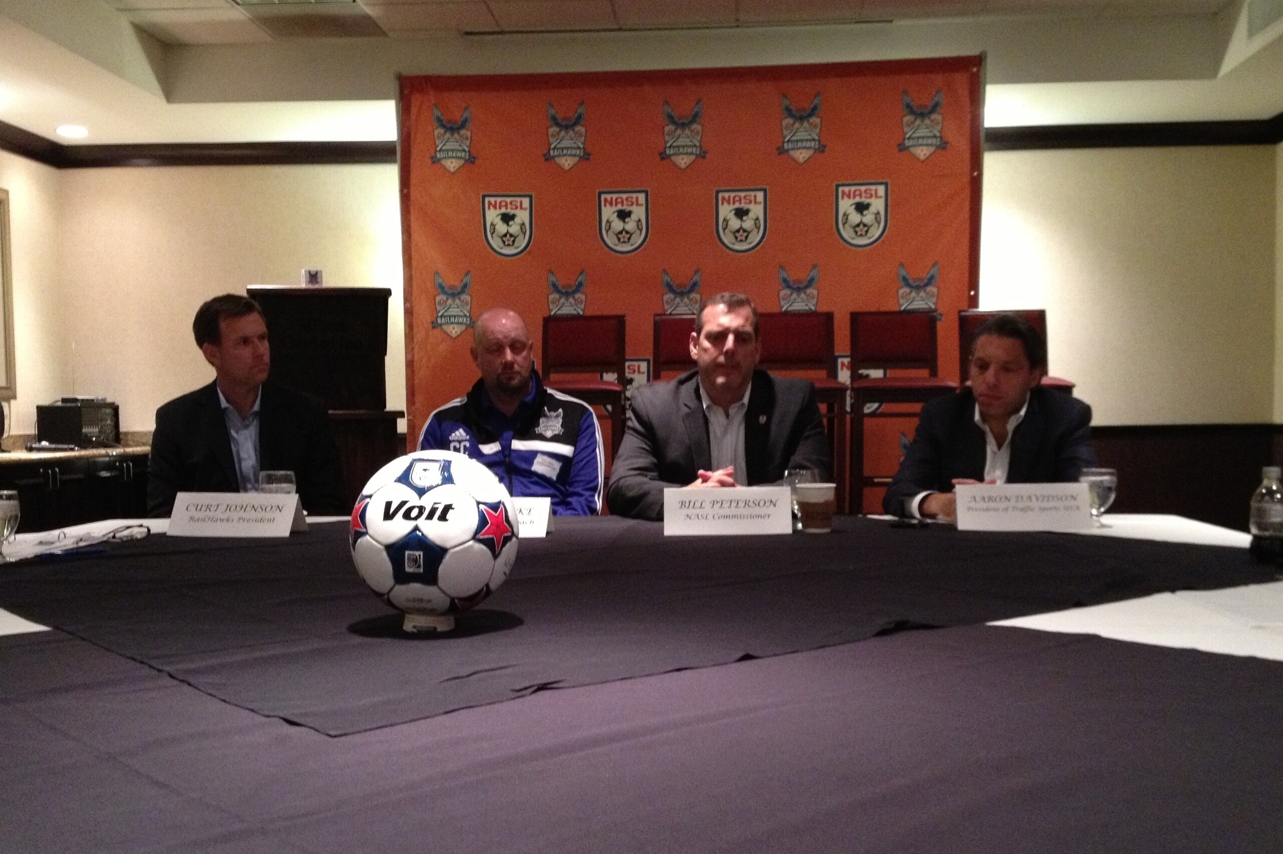 Bill Peterson (second from right) speaks along with (left to right) RailHawks president Curt Johnson, coach Colin Clarke and ownership representative Aaron Davidson. Bill Peterson (second from right) speaks along with (left to right) RailHawks president Curt Johnson, coach Colin Clarke and ownership representative Aaron Davidson.