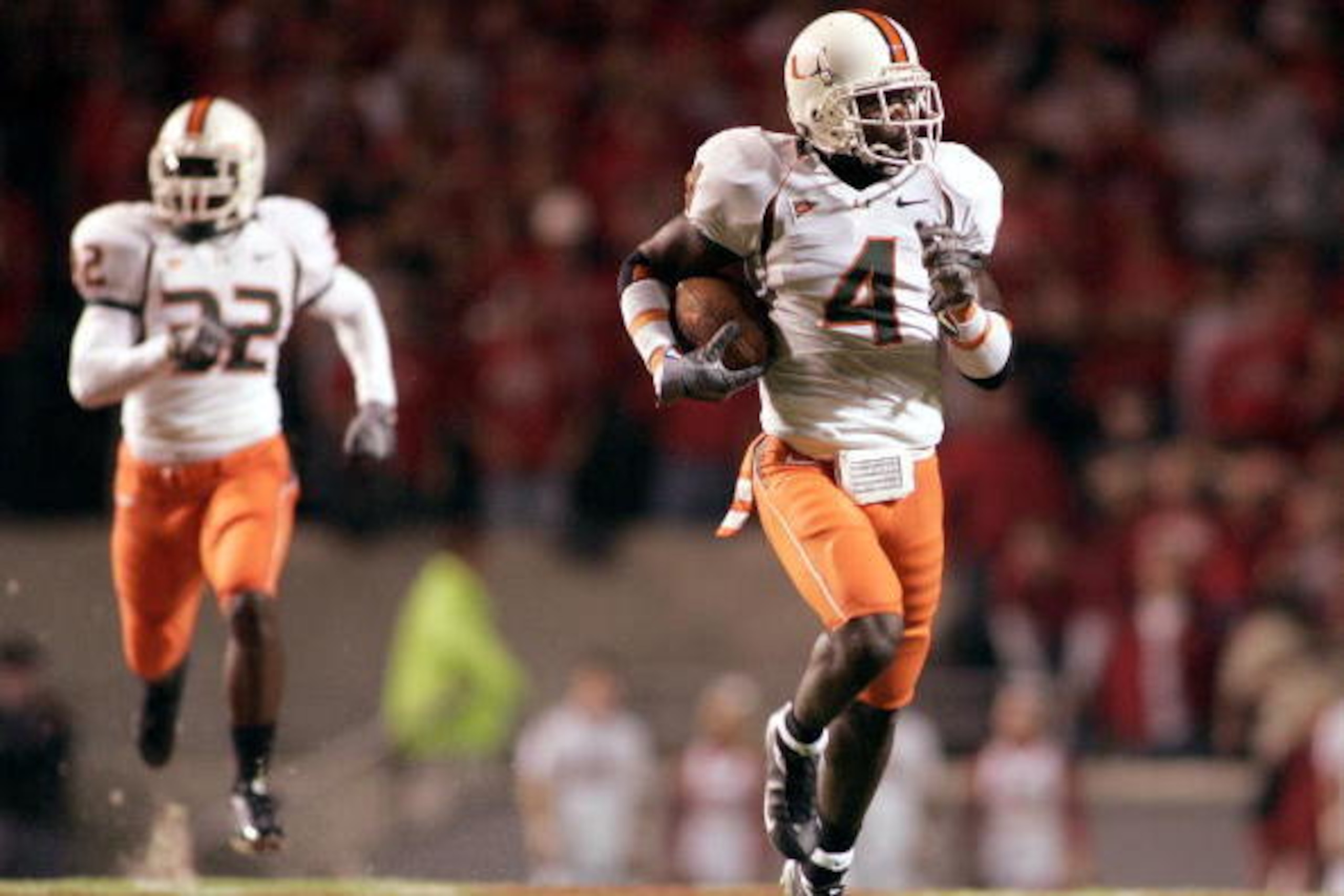 RALEIGH, NC - OCTOBER 23: Devin Hester #4 of the Miami Hurricanes returnns the opening kickoff 100 yards for a touchdown against the North Carolina State Wolfpack during an Atlantic Coast Conference game October 23, 2004, at Carter-Finley Stadium in Ralei RALEIGH, NC - OCTOBER 23: Devin Hester #4 of the Miami Hurricanes returnns the opening kickoff 100 yards for a touchdown against the North Carolina State Wolfpack during an Atlantic Coast Conference game October 23, 2004, at Carter-Finley Stadium in Ralei