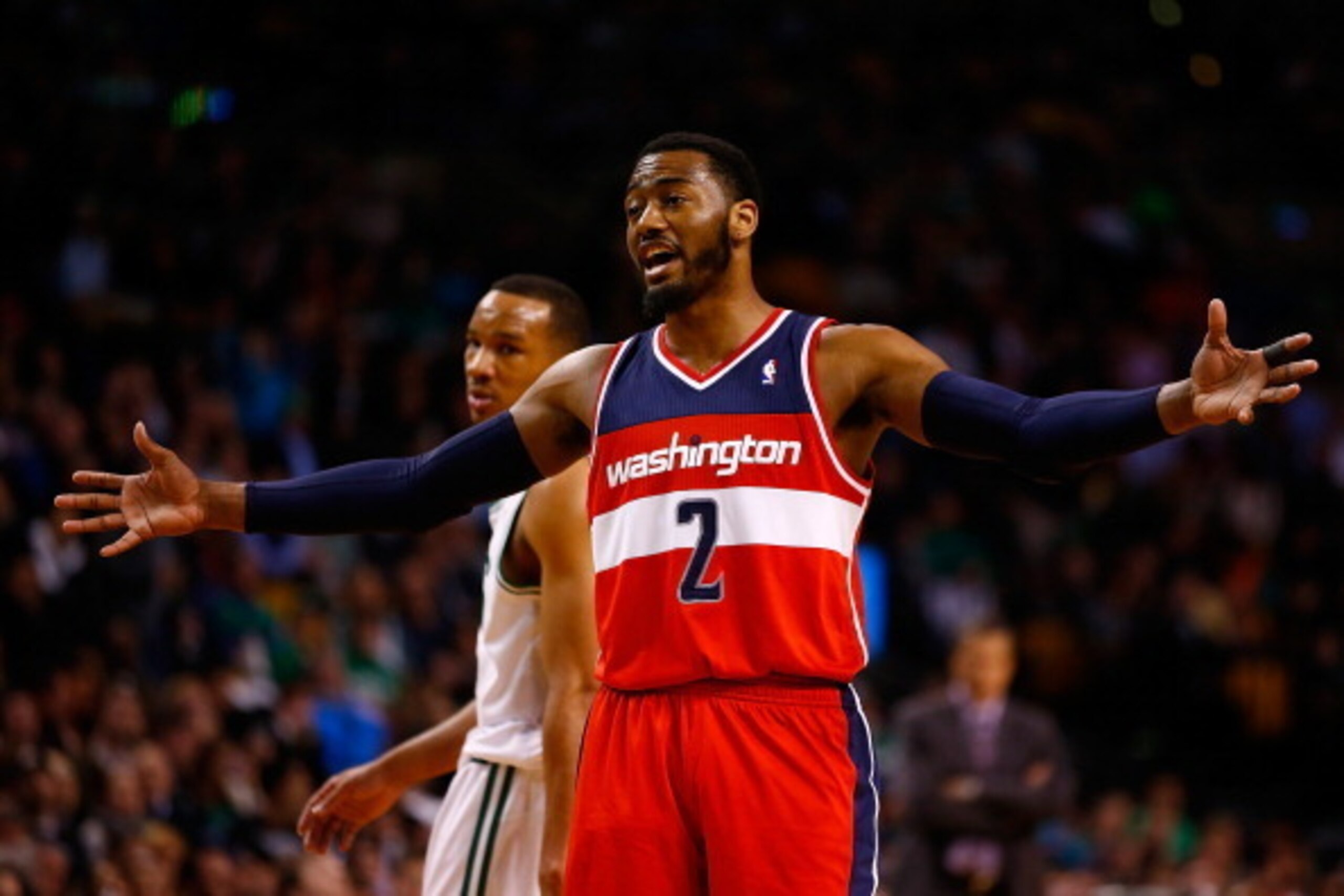 BOSTON, MA - APRIL 16:  John Wall #2 of the Washington Wizards talks to his teammates against the Boston Celtics in the second half during the game at TD Garden on April 16, 2014 in Boston, Massachusetts. NOTE TO USER: User expressly acknowledges and agre
