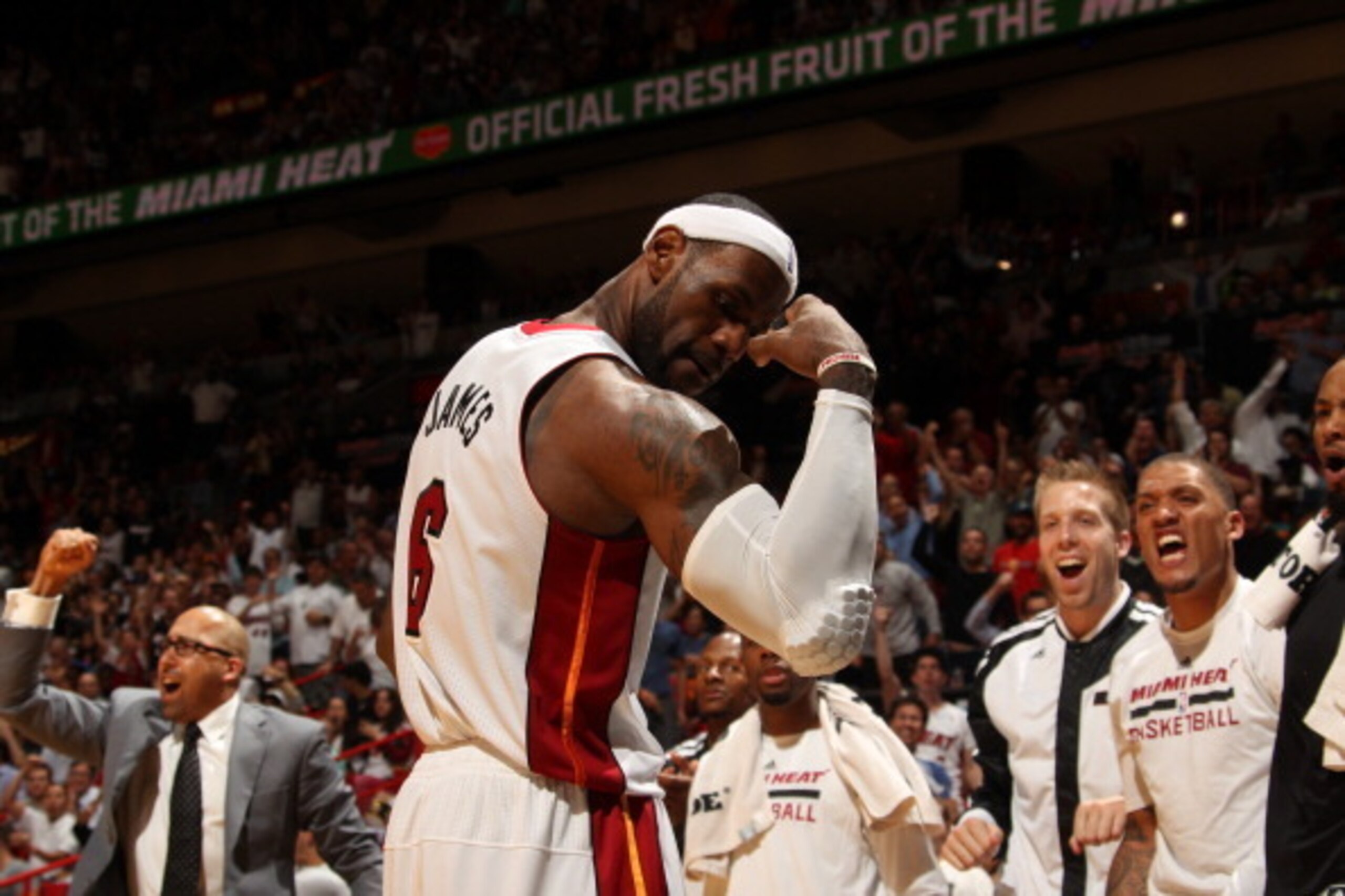 MIAMI, FL - April 11:   LeBron James #6 of the Miami Heat flexes during the game against the Indiana Pacers at the American Airlines Arena in Miami, Florida on April 11, 2014. NOTE TO USER: User expressly acknowledges and agrees that, by downloading and/o