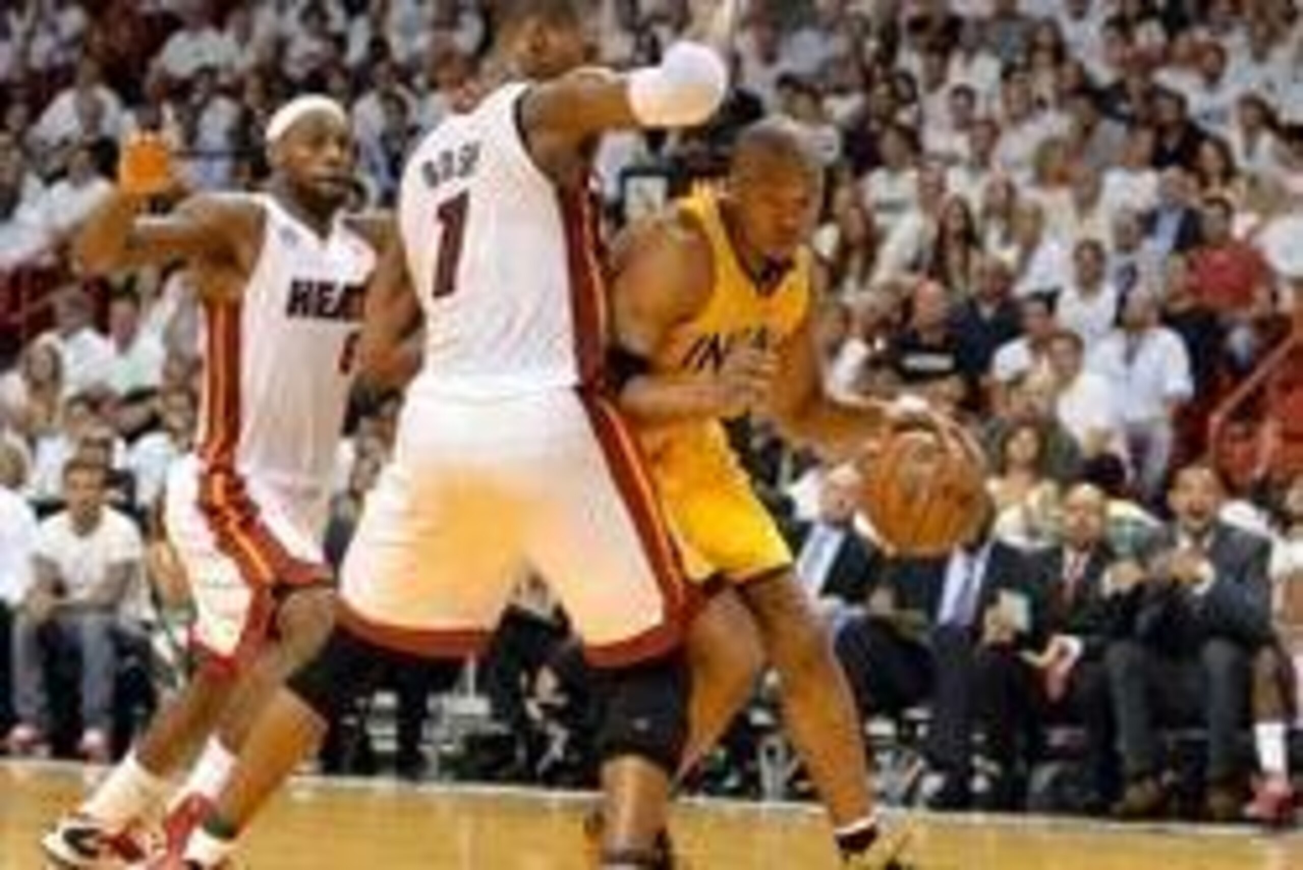 Jun 3, 2013; Miami, FL, USA; Indiana Pacers power forward David West (21) is defended by Miami Heat center Chris Bosh (1) and LeBron James (6) in the second quarter during game 7 of the 2013 NBA Eastern Conference Finals at American Airlines Arena. Mandat