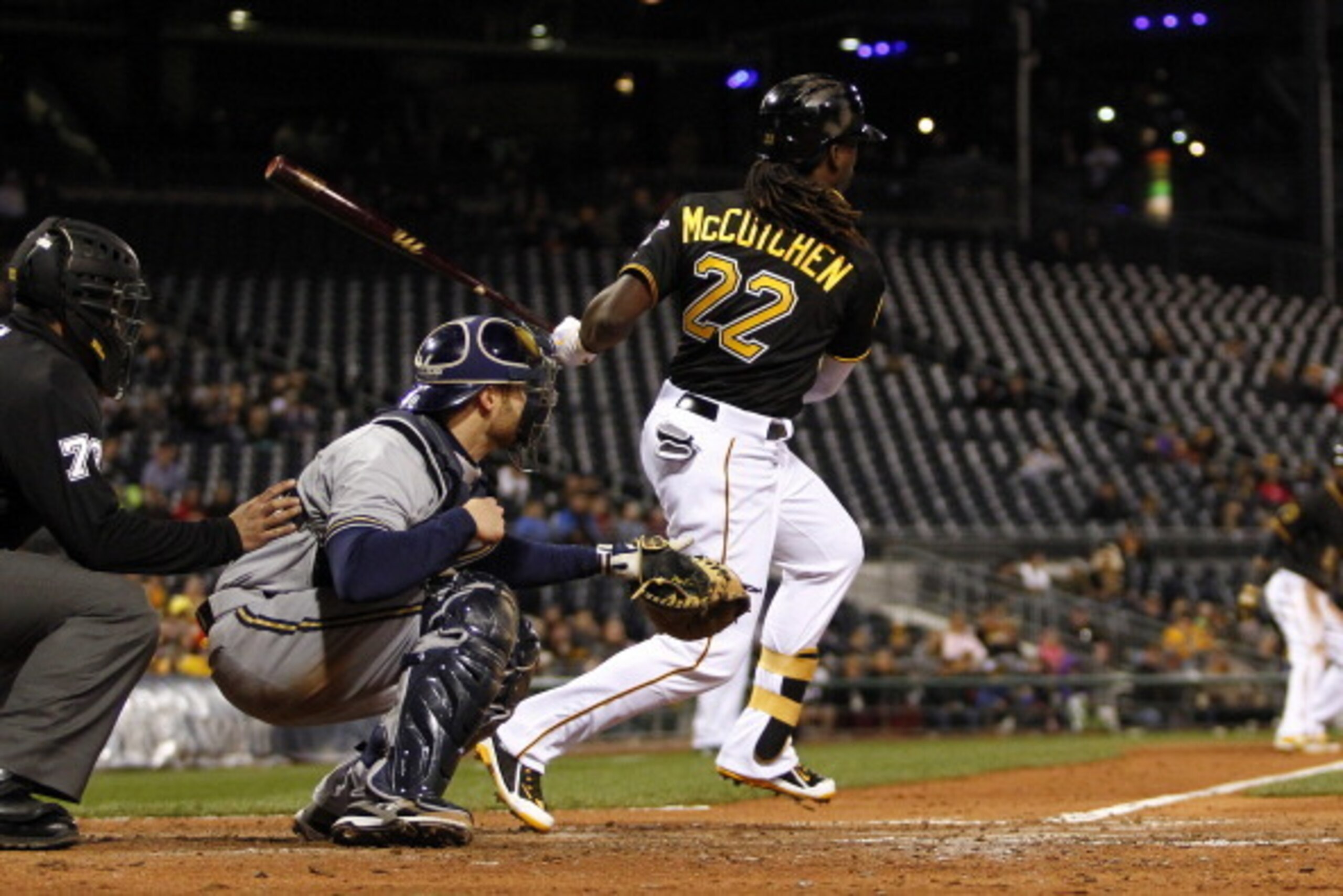 PITTSBURGH, PA - APRIL 17:  Andrew McCutchen #22 of the Pittsburgh Pirates grounds into a fielder's choice to shortstop scoring Starling Marte #6 in the seventh inning against the Milwaukee Brewers during the game at PNC Park April 17, 2014 in Pittsburgh,