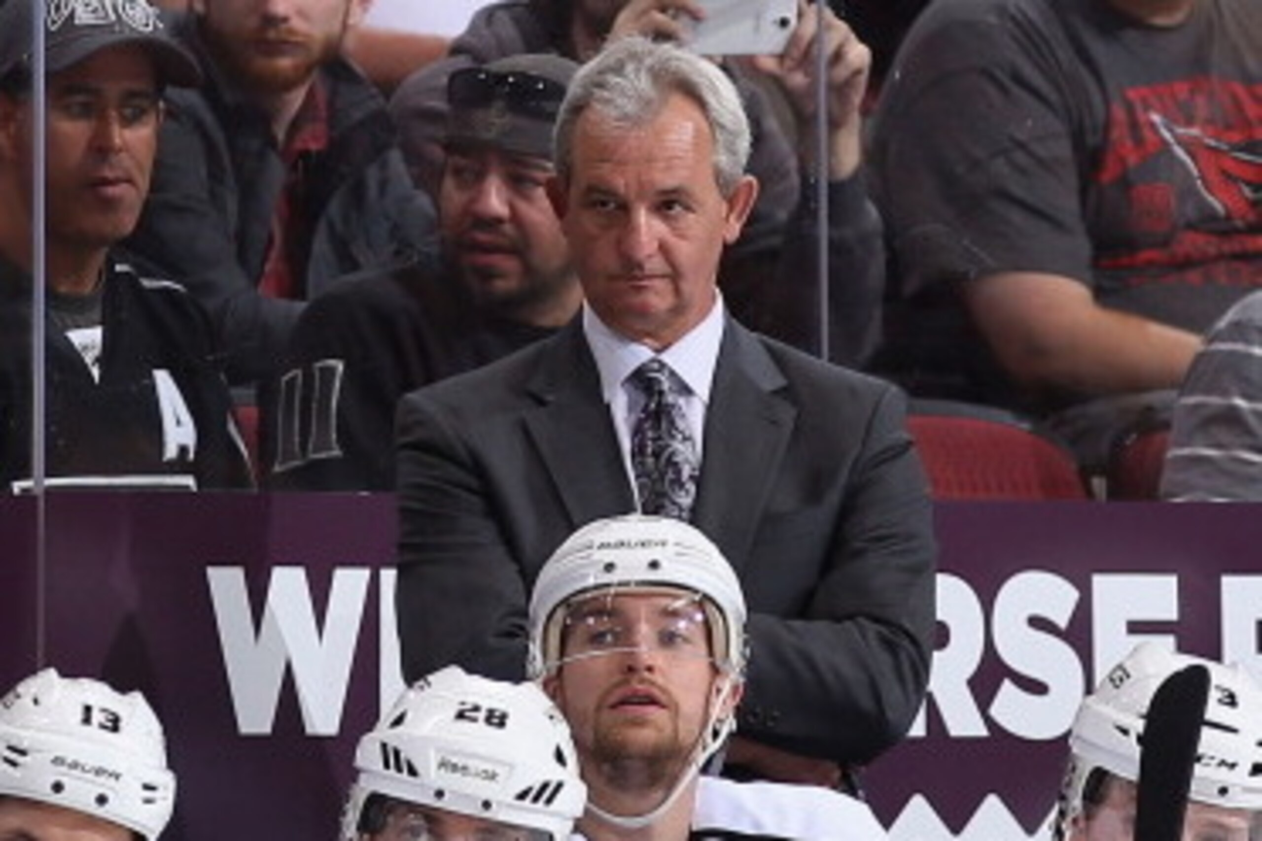 GLENDALE, AZ - JANUARY 28:  Head coach Darryl Sutter of the Los Angeles Kings watches from the bench during the NHL game against the Phoenix Coyotes at Jobing.com Arena on January 29, 2014 in Glendale, Arizona.  The Coyotes defeated the Kings 3-0.  (Photo