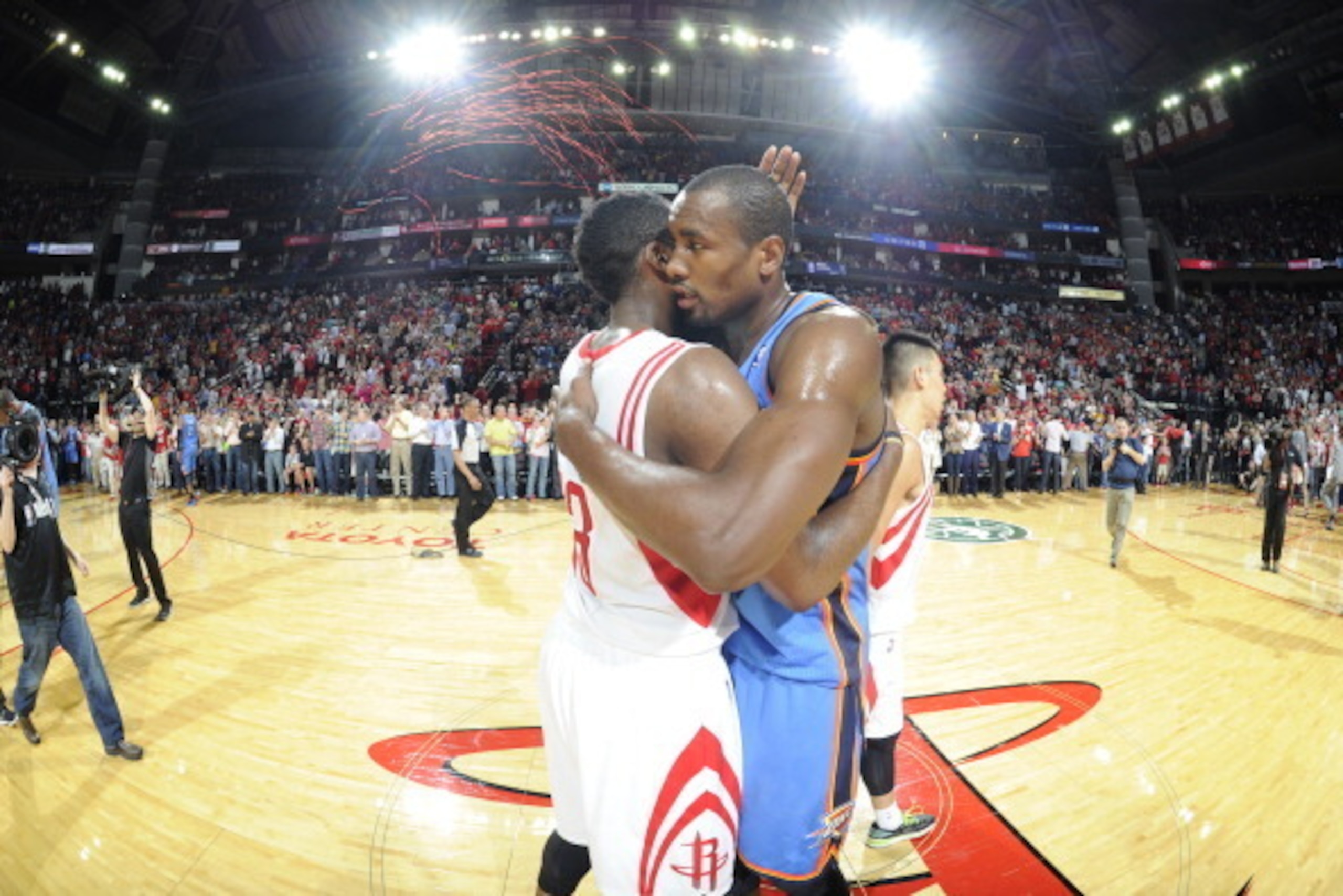 HOUSTON, TX - APRIL 4:  James Harden #13 of the Houston Rockets and Serge Ibaka #9 of the Oklahoma City Thunder hug after the game on April 4, 2014 at the Toyota Center in Houston, Texas. NOTE TO USER: User expressly acknowledges and agrees that, by downl