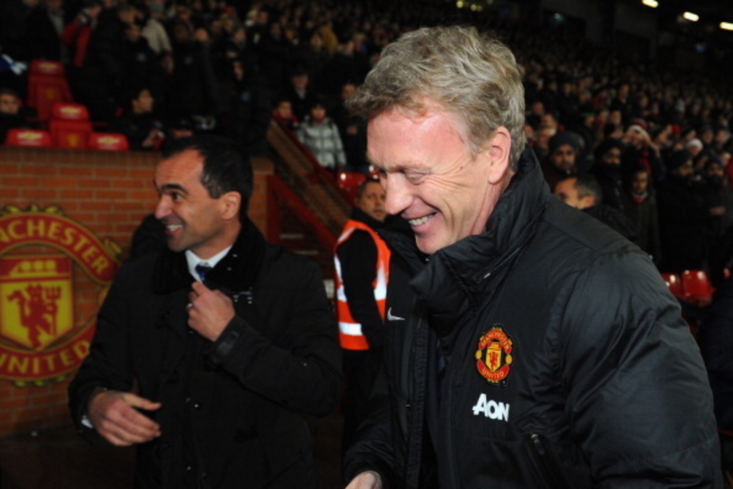 MANCHESTER, ENGLAND - DECEMBER 04:  Manchester United Manager David Moyes shares a joke with Everton Manager Roberto Martinez (L) prior to the Barclays Premier League match between Manchester United and Everton at Old Trafford on December 4, 2013 in Manch