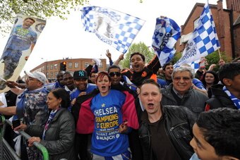 LONDON, ENGLAND - MAY 20:  Chelsea supporters celebrate during the Chelsea victory parade following their UEFA Champions League and FA Cup victories on May 20, 2012 in London, England. (Photo by Steve Bardens/Getty Images)