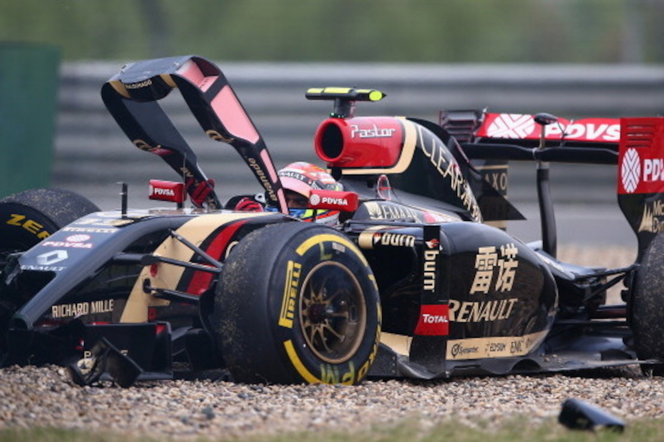 SHANGHAI, CHINA - APRIL 18:  Pastor Maldonado of Venezuela and Lotus crashes off the track during practice ahead of the Chinese Formula One Grand Prix at the Shanghai International Circuit on April 18, 2014 in Shanghai, China.  (Photo by Clive Mason/Getty
